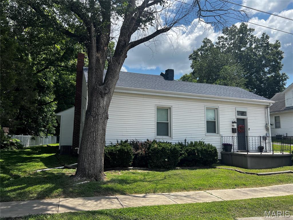 Originally built in 1908 and thoughtfully expanded over the years, this beautifully updated 3-bedroom, 2-bath home perfectly blends timeless character with today’s modern conveniences. Offering approximately 1,484 square feet of living space on a spacious lot of over one-third acre, this property is surrounded by mature shade trees that create a peaceful, park-like setting. The expansive backyard is ideal for entertaining, gardening, or simply relaxing, and offers ample space to add a detached garage—a desirable feature in this established neighborhood. Enjoy your morning coffee or evening sunsets from the backyard deck while taking in the beautiful surroundings.

Inside, you’ll appreciate the extensive updates that make this home truly move-in ready. Recent improvements include fresh paint throughout, new luxury vinyl plank flooring, new carpeting, updated light fixtures, ceiling fans, and beautiful white wood blinds. The inviting living room features a decorative fireplace with electric logs, creating a warm and cozy focal point.

The kitchen has been refreshed with updated cabinetry, a new drop ceiling, and all new appliances, making it both functional and attractive for everyday living. Both bathrooms have been updated with new adult-height vanities and modern finishes.

Additional features include a spacious main-floor laundry room, gas forced-air furnace and central air conditioning, two built-in bookcases that add charm and functionality, and a cellar beneath the original portion of the home, while the remainder of the house is situated on a crawlspace.

Major exterior improvements include a new roof and a chimney that has been professionally tuck-pointed and painted, providing both curb appeal and peace of mind for years to come.

If you’ve been searching for a home that offers character, modern updates, a beautiful oversized yard, and room to grow, this is the one. With the major improvements already completed, all that’s left to do is move in and enjoy!