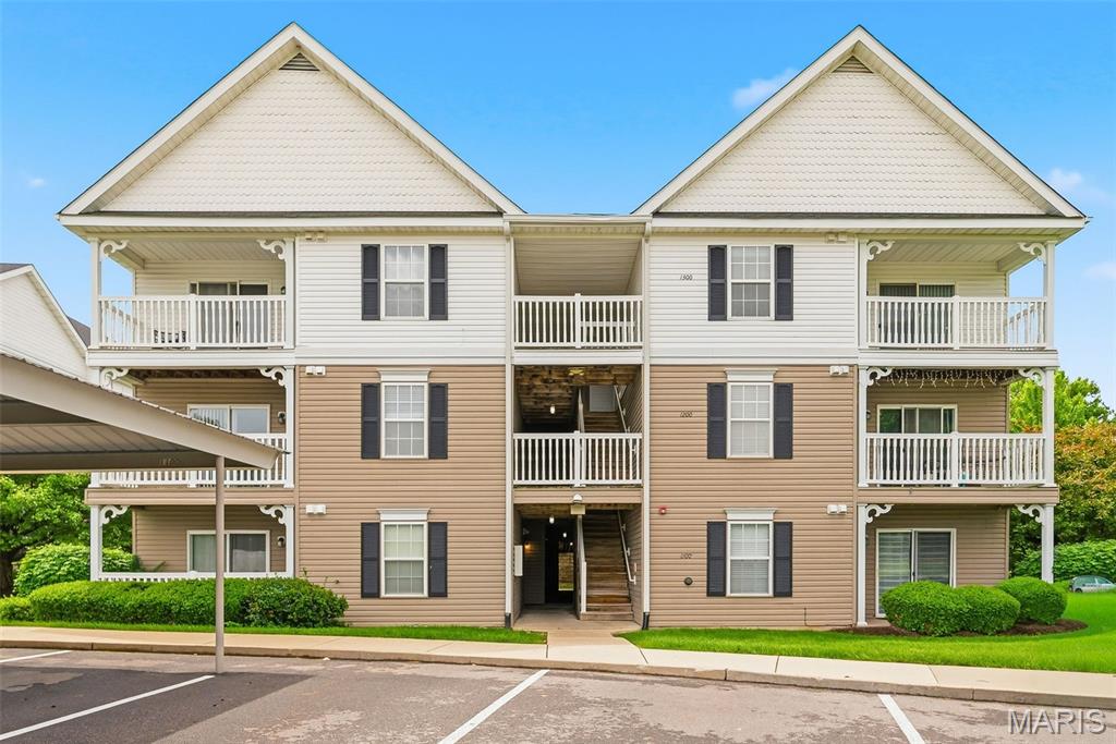 Convenient, low-maintenance living in an ideal location! This open-concept condo offers the ease of homeownership without the upkeep, along with access to great community amenities. Enjoy step-free entry directly from your covered parking space, and a bright, welcoming interior filled with natural light. The living room opens to a private balcony, perfect for relaxing or entertaining.

The kitchen is well-appointed with stainless steel appliances, a breakfast bar, and ample storage in beautiful maple cabinetry. The spacious primary suite features an ensuite bath with both a walk-in closet and a linen closet. A split-bedroom layout provides added privacy for the secondary bedroom, along with a second full bath.

Additional highlights include a private laundry area with a stacked washer and dryer (included in sale). Community amenities feature a playground, swimming pool, and basketball court, with water, trash, sewer, snow removal, and grounds maintenance all covered. Ideally situated near Hwy 40, you’ll have easy access to nearby restaurants, shopping, and everyday conveniences.