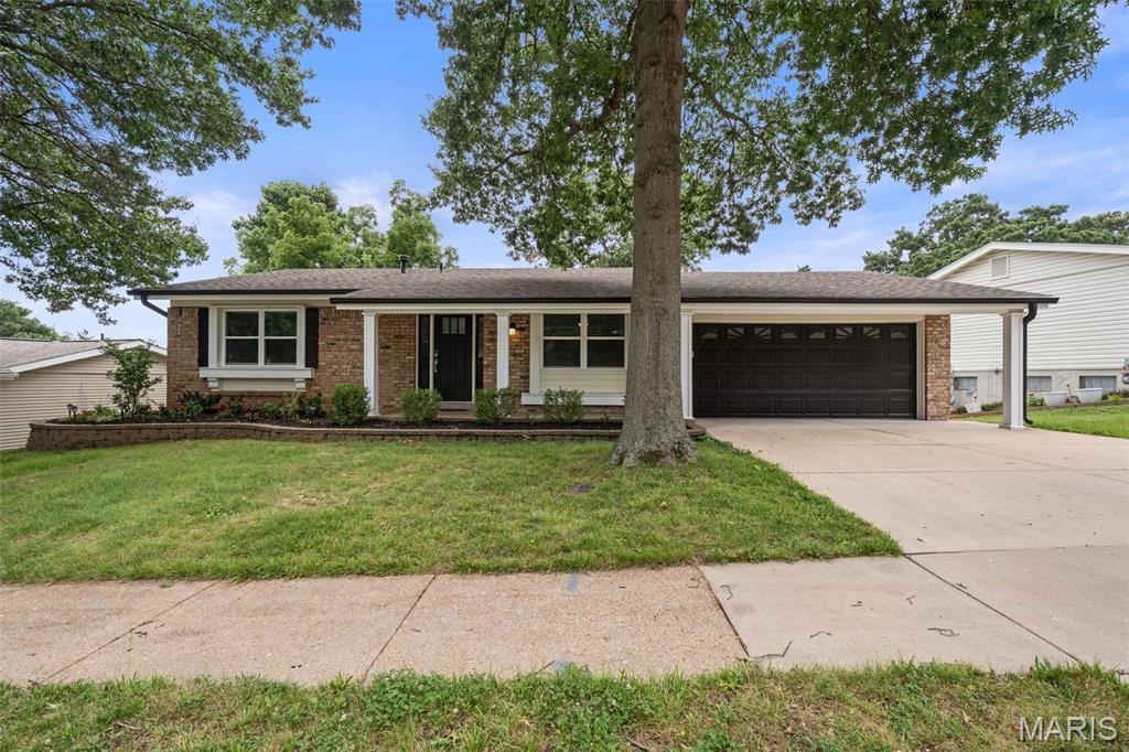 Completely renovated from top to bottom, this stunning Ballwin ranch is truly move-in ready! Located on a quiet street with a beautiful neighborhood pond and within the highly sought-after Parkway South School District, this 3-bedroom, 2-bath home has been thoughtfully redesigned with quality finishes throughout.

Inside, you'll find a spacious living room, a separate dining room, and a beautifully renovated kitchen featuring brand-new cabinetry, quartz countertops, stainless steel appliances—including a refrigerator, gas range, microwave, dishwasher, and beverage refrigerator—and modern finishes throughout.. The private primary suite offers a walk-in closet and a fully renovated bathroom.

Just off the kitchen, step onto the deck overlooking the large, level backyard. An added bonus is the finished attached flex space at the rear of the garage, complete with drywall, finished flooring, and lighting—perfect for a home office, hobby room, workshop, workout space, playroom, or extra storage.
The finished walkout lower level provides expansive recreation space along with a beautifully finished laundry room and ample extra storage!

The updates are extensive, including all new windows (even in the basement), new doors, all new flooring, all new lighting, beautifully renovated bathrooms, custom woodwork around the windows and doors, updated landscaping, gutter guards, a newer roof (approximately 2 years old), a new 200-amp electrical panel, and a sewer lateral that has been scoped and repaired in conjunction with the City of Ballwin. Even the attached two-car garage has been finished with drywall and epoxy flooring.

Beautiful renovations, a fantastic location, and truly move-in ready—this is one you won't want to miss! *Please note that the Bonus Flex Space is missing from the provided floorplan. It is an approx 200SqFt finished room off the back of the garage!
