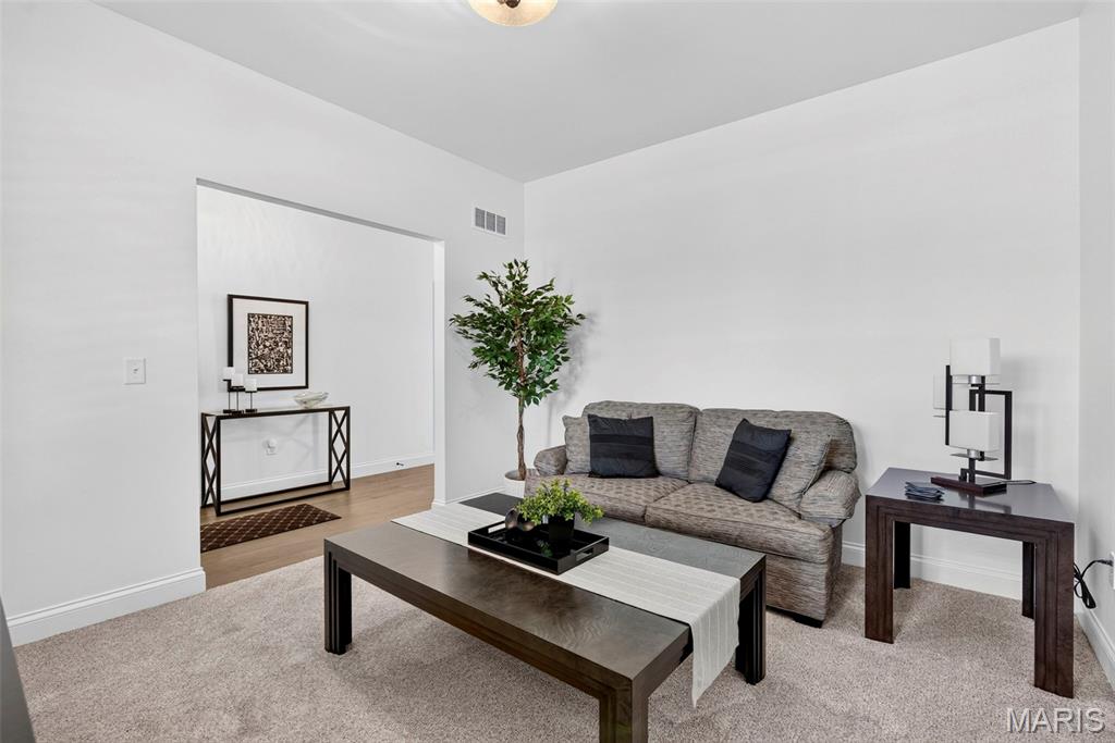 OPEN HOUSE SUNDAY, AUGUST 23RD 2026 2 PM - 4 PM! New construction sounds great until you start adding everything you actually want. This home gives you the advantages of a brand new build without the timeline, builder upgrade premiums, unfinished yard, or endless punch list all at a price below what it would cost to build and upgrade yourself. The expensive decisions have already been made, and the work is already done. 

Backing up to protected common ground that will remain undeveloped, this home offers extra privacy, and a backyard feel that extends well beyond the property line. 

The upgrades start at the curb: professional landscaping, epoxy stonework at the entry and rear patio, fresh interior paint, and brand-new plantation shutters throughout give it a finished polish most new builds don't have on day one. 
Inside, every bedroom has new Mohawk carpet, while the main living spaces feature luxury vinyl flooring. The open-concept kitchen, dining, and living area is filled with natural light and flows out to a 10x14 composite deck. The kitchen itself is the one you'd be paying the builder extra for: quartz counters, an oversized island with sink, top-of-the-line appliances, custom cabinetry, pull-out shelving, and soft-close doors. The primary suite matches the finish level — dual vanities, generous storage, and a frameless walk-in shower wrapped in floor-to-ceiling tile. 

A versatile bonus room at the front of the home can flex as an office, playroom, second living area, or guest bedroom. Downstairs, the walk-out lower level is already stubbed for a full bath — ready to become another bedroom, theater, gym, or guest suite, with much of the groundwork already done. 

The oversized garage has also received the kind of upgrades buyers usually have to request including completed drywall and additional electrical outlets. It's clean, functional, and ready for vehicles, storage, hobbies, or a workshop. Outside, the walk-out patio has under-decking for all weather protection, and the professional landscaping carries the finished feel all the way to the back of the property. 

Location works too: Highways 64, 70, and 364 are all close by, schools are convenient, WingHaven Country Club is minutes away, and Lake St. Louis, Dardenne Prairie, and Wentzville are all within easy reach for shopping, dining, and entertainment. 

This isn't the compromise between new construction and resale — it's the smarter alternative to both.