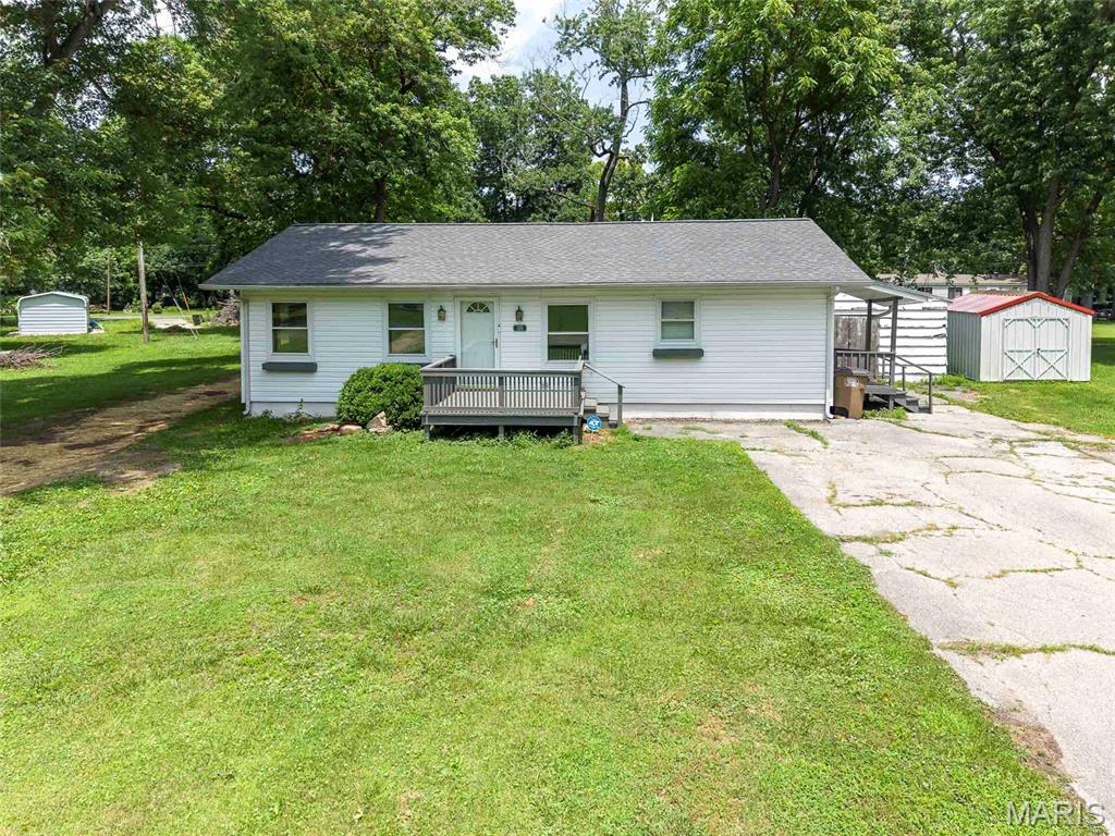 Welcome home to this inviting 3-bedroom, 1-bath residence situated on nearly half an acre in a desirable corner lot location. Offering privacy and room to roam, this property provides the perfect blend of comfortable living and outdoor enjoyment.
Step inside to a bright and airy layout where the large living room flows seamlessly into the eat-in kitchen. The living room boasts excellent natural lighting and generous space, making it ideal for relaxing or entertaining. The kitchen features nice cabinetry, ample counter space, and comes equipped with appliances — perfect for everyday meals and casual gatherings.
The three large, spacious bedrooms offer plenty of room to unwind, each with nice-sized closets for convenient storage. The full bathroom serves the home efficiently.
Outside, the freshly painted front porch welcomes you with curb appeal. Enjoy the expansive, open yard with wonderful privacy, complemented by a 1-car detached garage and a large shed for additional storage or workspace. This sizable lot is a rare find, providing space for gardening, play, or future outdoor projects.
With its thoughtful layout, functional features, and generous outdoor space, this home is move-in ready and full of potential. Whether you’re a first-time buyer, growing family, or looking for a peaceful retreat, don’t miss this opportunity!
Schedule your showing today and imagine making this house your own.