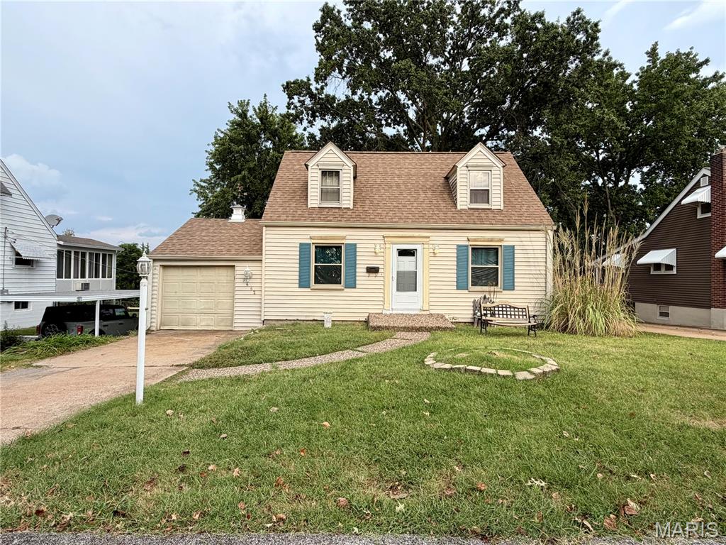 Open House Sunday 10am-noon.  Tons of potential with this 1.5 story Affton home. Walk inside and notice the original hardwood flooring throughout the main living/dining room and main floor bedroom.  The living room features 2 original stained glass windows. The kitchen flows into the sunroom which leads to fenced flat yard. Beautifully trimmed stairway leads upstairs to 2 additional bedrooms.  The walk out lower level features several finished rooms, 2 large storage closets, and a  laundry/storage room. Garage with workbench has a back door that opens to a covered porch and patio area. Property is being sold "as is". Seller to make no repairs or provide warranties or inspections. Please use a special sales contract.