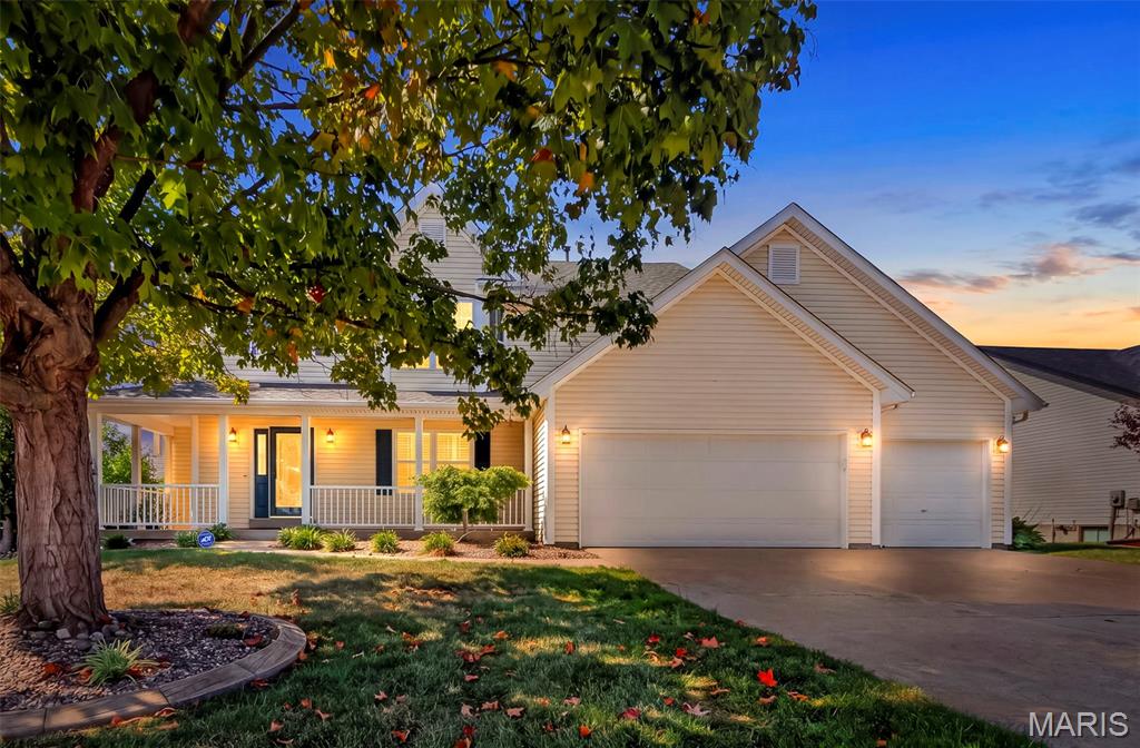 Stunning 1.5-Story Home on a Corner Lot! Welcome to this beautifully appointed 1.5-story home offering 4 bedrooms and 3.5 baths, thoughtfully designed with elegant finishes, spacious living areas, and exceptional indoor-outdoor living. A charming wrap-around covered porch welcomes you through a distinctive decorative oval glass front door and sets the tone for the warmth and character found throughout the home. Step inside to a dramatic 2-story entry foyer featuring hardwood flooring, a decorative plant shelf, and a beautiful spindle-railing staircase overlooking the entry. The spacious main level features a formal dining room with chair rail and crown molding, along with four bay windows that fill the home with natural light and add architectural character. The main-floor primary suite is a true retreat, highlighted by an elegant, coffered ceiling, two walk-in closets, and a private bath. The heart of the home is the open kitchen and breakfast room combination, perfect for everyday living and entertaining. The kitchen features quartz countertops, peninsula seating, built-in microwave, dishwasher, and stove/oven, while the adjoining breakfast area provides a welcoming space for casual dining.  Plantation shutters throughout the main level, along with updated lighting and ceiling fans, add both style and comfort.  Upstairs, you'll find three additional bedrooms, including a second spacious bedroom with its own private bath, plus a versatile loft overlooking the entry foyer—perfect for a home office, reading area, playroom, or additional living space. The unfinished basement offers a rough-in for a future bathroom and plenty of opportunity to create additional finished living space to suit your needs.  Outside, enjoy the privacy and curb appeal of a fenced corner lot featuring a patio and charming pergola, creating the perfect setting for outdoor entertaining or relaxing. An in-ground sprinkler system keeps the lawn looking its best, while LeafFilter gutter guards provide added convenience and help reduce exterior maintenance.  With its beautiful architectural details, updated lighting, four bay windows, spacious floor plan, elegant finishes, and fantastic outdoor amenities, this home offers an exceptional combination of comfort, style, and functionality. This is one you won't want to miss!