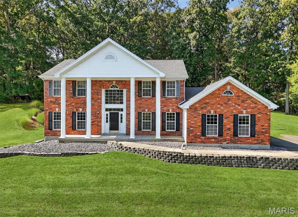 Gorgeous 2 Story in the heart of Wildwood! From the moment you step into the soaring entryway, you’ll feel the warmth and charm of this beautifully cared for home. The living and dining rooms set an elegant tone with crown molding and plenty of natural light, while the family room invites you to gather around the cozy gas fireplace framed by built-ins and a bright bay window. The spacious kitchen offers the perfect blend of function and style, with granite counters, vaulted ceilings, stainless appliances, walk-in pantry, and a large center island that makes entertaining easy. Just off the kitchen, a thoughtfully designed laundry room with custom cabinetry, sink, and storage keeps everything organized. Upstairs, the primary suite is a true retreat with vaulted ceilings, dual walk-in closets, and a spa-like bath featuring a soaking tub, dual vanities, and walk-in shower. Three additional bedrooms with generous closets share a stylish hall bath with dual vanity and custom tile. A brand new driveway, central vacuum, in-ground sprinklers, and oversized 2-car garage add everyday convenience, while the unfinished lower level offers endless potential for future living space. With its balance of updates, classic finishes, and thoughtful design, this home is move-in ready and waiting for its next chapter.