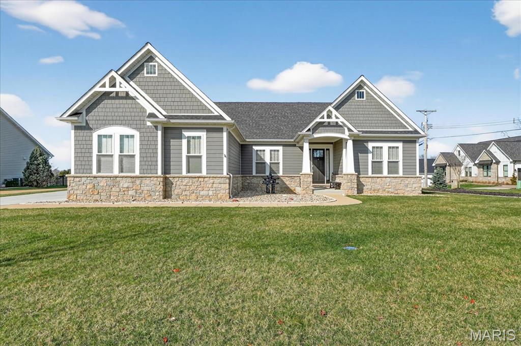 Showings begin Thursday, April 9th. Better than new and absolutely immaculate, this Wildwood craftsman-style ranch is the one buyers wait for. Offering approximately 2,700 square feet on the main level plus a beautifully finished lower level, this exceptional home combines timeless design, elevated finishes, and an ideal floor plan in an enclave of custom homes within walking distance to shops and restaurants. With 4 bedrooms, 4.5 baths, and a 3-car side-entry garage with epoxy floors, the home is thoughtfully designed for both comfortable daily living and effortless entertaining. The open-concept main living area is anchored by a stunning stone direct-vent fireplace and flows seamlessly into the designer kitchen, featuring custom 42" maple cabinetry, Cambria countertops, stainless KitchenAid appliances, a Sharp micro-drawer, and a professional-grade 6-burner gas range that brings both style and serious function to the heart of the home. A spacious dining area, private study, and inviting screened-in patio add to the home’s versatility and charm. Premium upgrades include Andersen windows, solid wide-plank oak floors, soaring 10-foot ceilings, and exceptional craftsmanship throughout. The luxurious primary suite is a true retreat, complete with beautiful tile selections, a freestanding soaking tub, and dual custom-designed closets. The divided floor plan offers 2 other main floor bedrooms; each with en suite baths on the other side of the home. The finished lower level continues the same level of quality and includes a spacious recreation room, gym, full bath, and 4th bedroom with egress window and oversized walk-in closet. Nestled within a small enclave of custom-built homes, this property offers an exceptional Wildwood location with the charm of a quiet neighborhood setting close to everything buyers love about the area. With James Hardie siding, impeccable condition, and finishes that truly rival new construction, this is a rare opportunity to own a move-in-ready home that checks every box. Exquisitely finished and flawlessly maintained, this is the kind of home buyers hope for—but rarely find.