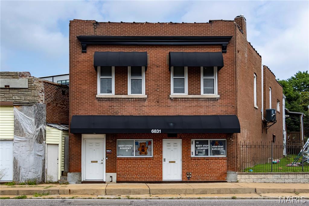 6831 Manchester Avenue presents a versatile owner/user or investor opportunity in the St. Louis City South submarket, just minutes from Maplewood’s vibrant commercial corridor. This 4,000 SF, two-story brick building was constructed in 1908 and is currently fully vacant, offering a buyer the flexibility to occupy one or both floors or lease the entire building.
The building features two distinct 2,000 SF floor plates across two levels. The upper level offers a functional, multi-room office layout with private offices, a conference/meeting room, and common areas well-suited for a professional services firm, nonprofit, or similar user. The lower level was previously improved for daycare/childcare use and features an open layout, stairway access, and rear outdoor area – adaptable for a range of commercial tenants.
Both levels are available for lease: upper level at $12 PSF modified gross (plus utilities) and lower level at $18 PSF NNN, offering a buyer immediate leasing upside or the option to occupy and generate rental income from the remaining unit.
The property has seen meaningful recent capital investment including new HVAC, updated front doors, Helitech waterproofing, and an aluminum roofing treatment – reducing near-term capital expenditure concerns for a buyer.
The building sits on a 6,098 SF parcel (0.14 AC) zoned J, with frontage on Manchester Avenue – one of St. Louis City’s primary commercial arterials carrying 21,734 vehicles per day. The property is within a 5-6 minute drive of two MetroLink commuter rail stations (Maplewood-Manchester and Sunnen), with convenient access to I-44 and US-100.
Demographics within one mile reflect an established, stable neighborhood: average household income of $95,665, 8,547 households, and a total population of 15,770. Offered at $400,000 ($100/SF).