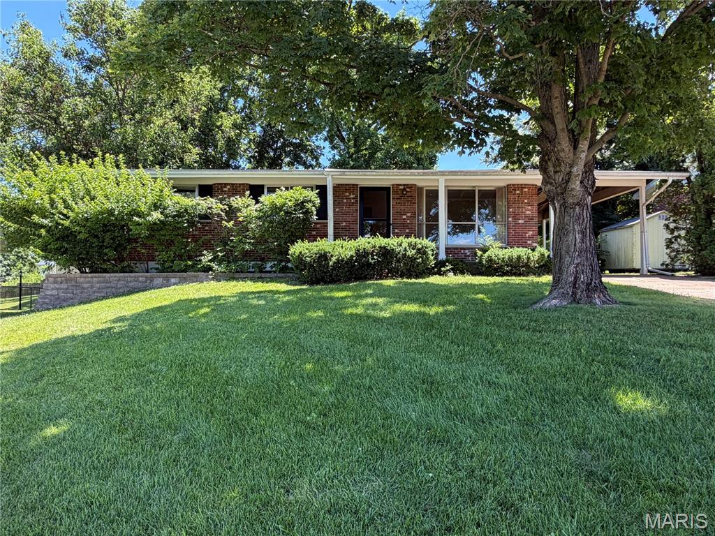 Nice all  brick home in South County close to schools, major highway and shopping.  This home features large living room, eat-in kitchen with a full array of appliances, 3 bedrooms and 1 bath.  The bedrooms have carpet, but all have hardwood flooring underneath. Walk-out basement has been professionally treated for mold.  All drywall has been removed to the studs.  Bathroom is plumbed for shower, toilet and vanity.  All documentation is attached and transferable to the new owners.   Basement is ready for new owner's design.  Additional features include 1 car covered carport, fenced backyard and covered front porch.  Home is ready for its new owner and can close quickly.