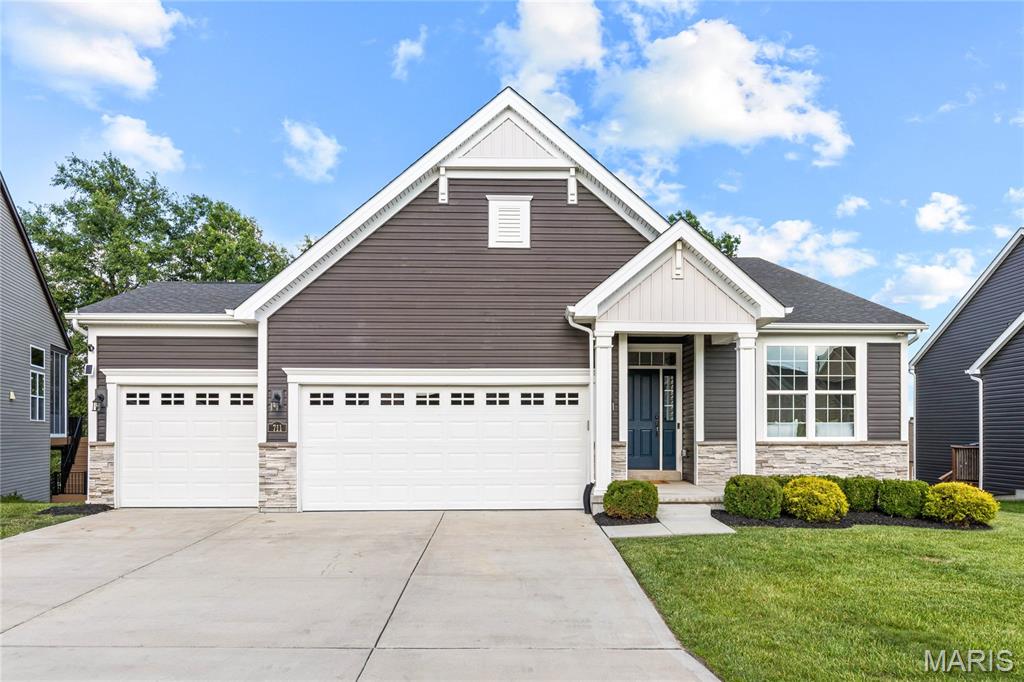 Sophisticated 3-bedroom, 3-bath great room ranch from Payne Family Homes. This popular “Denmark” floor plan offers an open, light-filled layout with custom amenities & design elements throughout including wide plank luxury vinyl, 12’ ceilings & contemporary lighting. Welcoming covered porch entrance leads to spacious great room with granite fireplace flanked by full-height windows and dining room with sliding glass door that opens to private deck. The adjacent chef’s kitchen features granite countertops, 42” white Shaker cabinetry, premium appliances & 8’ center island. A coffered primary bedroom suite with luxury bath with walk-in shower provides an appealing retreat. 2 Additional bedrooms & hall full bath complete the main floor living quarters. Lower Level entertainment space includes expansive recreation room with 13’ wet bar, game room & full bath. Situated on a premium cul-de-sac lot with composite deck, covered patio & 3-car garage. Cottle Village with The Tavern, Farmstead Distillery & The Field concert venue is just a short walk or cart ride away.