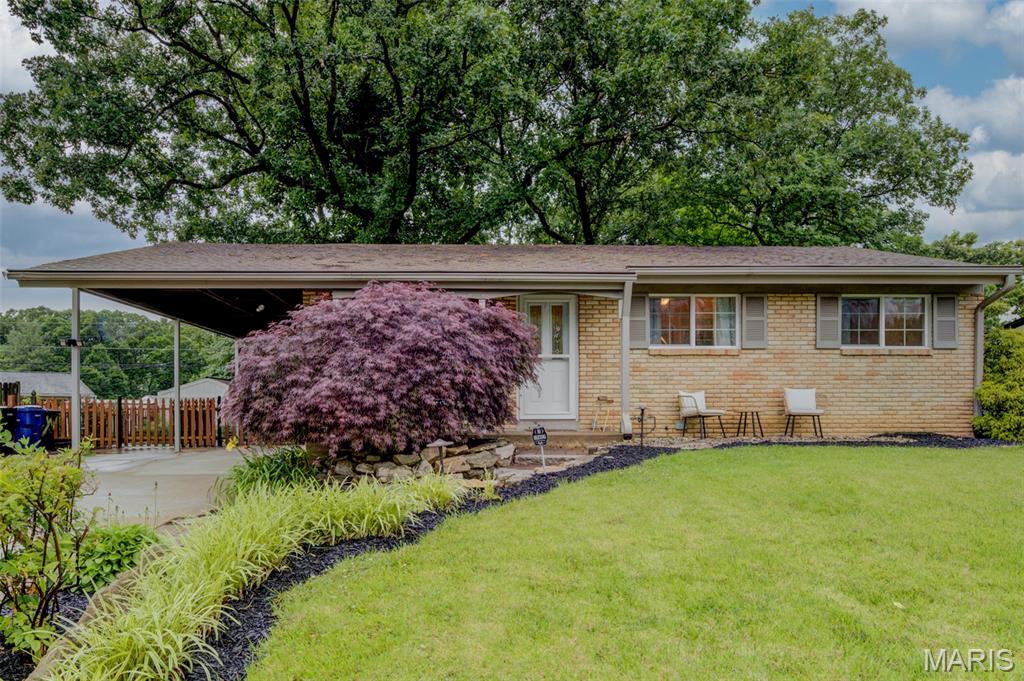 Welcome to your sanctuary in the heart of the Rockwood School District—a thoughtfully appointed 3-bedroom, 3-bathroom ranch that proves great homes come in perfectly proportioned packages. This 1963 gem sits on a park-like, professionally landscaped lot in the desirable Bentley Manor neighborhood, with easy access to I-44 and Highway 141 for seamless commuting. Inside, original hardwood and tile flooring frame a warm, inviting open layout. The updated kitchen features newer stainless steel appliances and fresh light fixtures; a finished walk-out basement with full bathroom doubles your entertaining and living space. Step outside to your private oasis: mature shade trees, irrigation system, and multiple sitting areas connected by elegant brick and stone pathways—perfectly maintained yet low-maintenance. The widened driveway and carport ensure abundant parking. At $305,000, this is where smart value meets community charm. Your park-like retreat awaits—tour it today.