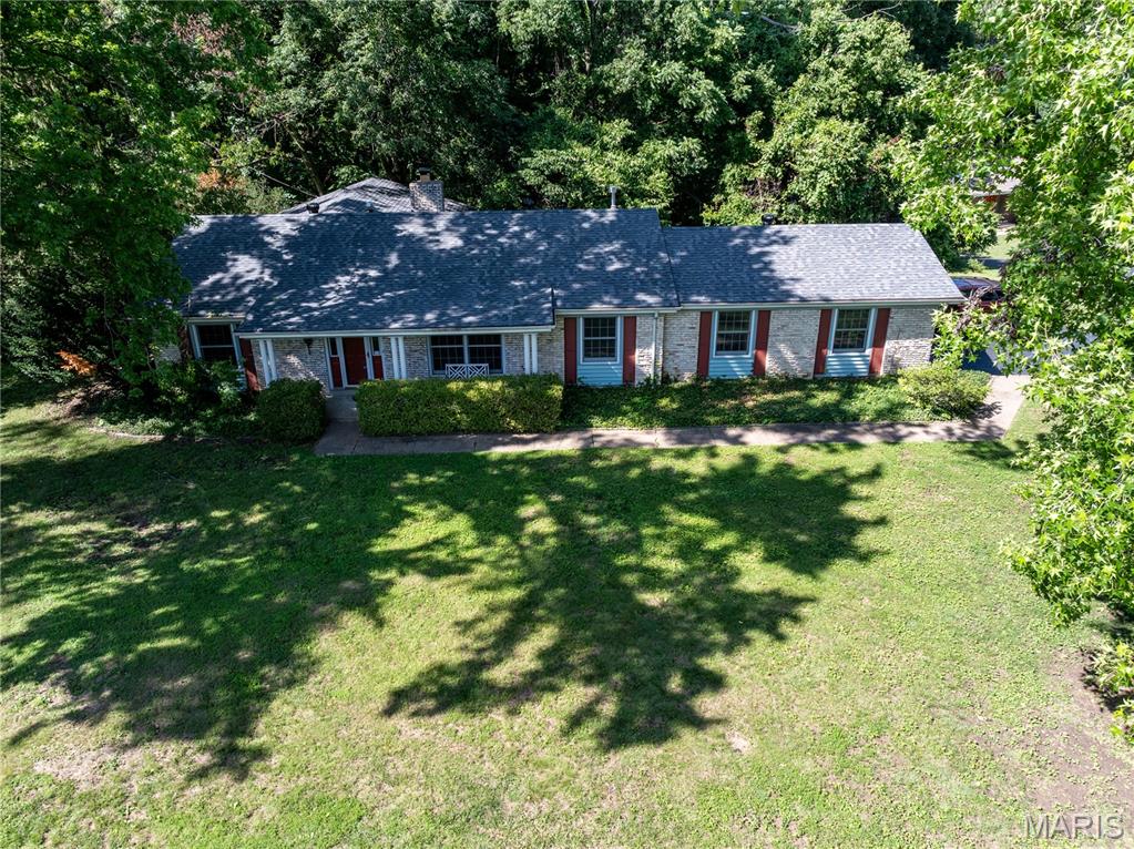 Don't miss your chance to make this home in River Bend, one of the best West County neighborhoods, your new home. This 1,832 sq ft single level home greets you with new flooring and paint. It is a blank canvas waiting for your special touch.  The open floor plan welcomes you in and captivates with all the possibilities. The floor plan flows effortlessly through a spacious living room, dining room and family room which leads into the open kitchen with eating area, and a charming breakfast bar area. The family room, complete with wood burning brick fireplace, offers a cozy place to spend the winter evenings. The home also offers three bedrooms and two well appointed bathrooms. The master suite is in the back of the home and has access to the patio. There is a nice size dedicated laundry area off the kitchen. The home features an oversized 2-car garage with additional storage. The home had a new HVAC system installed & Wood Flooring throughout in 2025. New roof installed May of 2026 and painting throughout June of 2026. Please open all the closet doors and you will discover this home has a LOT of storage. This isn't just a house; it's an opportunity to live in a very social neighborhood - where multi-generations march in the 4th of July parade ending at the neighborhood pool. . (annual special membership fee applies for the pool and tennis courts-please confirm price) Please call today for your private showing.