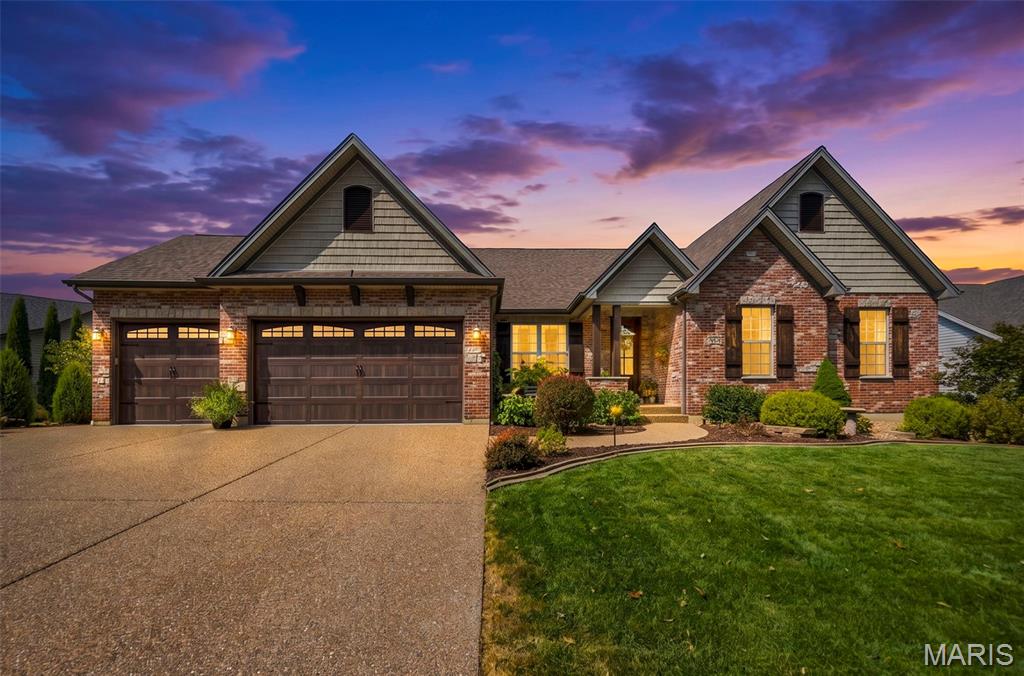 Don't miss this rare opportunity to own a custom-built Aiello home.  Tucked away on a quiet cul-de-sac and backing to a beautiful, wooded setting, this extraordinary home combines timeless craftsmanship, premium finishes, and an incredible amount of living and entertaining space. This home has been meticulously cared for and thoughtfully enhanced. It doesn't just look like a new home—it looks even better than the day it was first built! From the moment you arrive, the impressive brick and stone custom elevation and 8' solid mahogany front door set the tone for the quality found throughout. Inside, you'll discover hardwood flooring, extensive crown molding, 5 1/4" baseboards, 4' wide custom stairs, cased openings, custom bookcases in the great room, can lighting, ceiling fans, and a dramatic fireplace with stone extending all the way to the ceiling. The beautifully appointed kitchen features granite countertops and elegant travertine ceramic tile. The fully finished walk-out lower level offers an entire additional living and entertaining experience. This incredible space includes a private bedroom, full bathroom, bar area, and expansive entertainment area, making it ideal for guests, game days, movie nights, or unforgettable gatherings. Step outside to your private patio with a fireplace, perfectly positioned to overlook the peaceful, wooded backyard with in-ground sprinkler system. Homes of this caliber, condition, and setting don't come along often. Meticulously maintained, beautifully enhanced, and offering a level of quality that is immediately apparent, this exceptional residence is truly better than new. Come experience it for yourself—you won't want to miss this one!