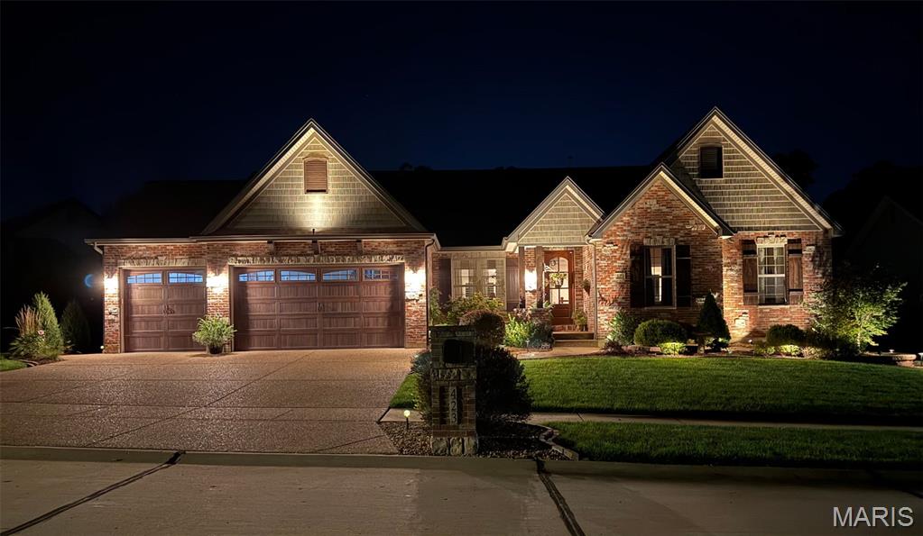 Professional photos coming soon! Don't miss this rare opportunity to own a custom-built Aiello home.  Tucked away on a quiet cul-de-sac and backing to a beautiful, wooded setting, this extraordinary home combines timeless craftsmanship, premium finishes, and an incredible amount of living and entertaining space. This home has been meticulously cared for and thoughtfully enhanced. It doesn't just look like a new home—it looks even better than the day it was first built! From the moment you arrive, the impressive brick and stone custom elevation and 8' solid mahogany front door set the tone for the quality found throughout. Inside, you'll discover hardwood flooring, extensive crown molding, 5 1/4" baseboards, 4' wide custom stairs, cased openings, custom bookcases in the great room, can lighting, ceiling fans, and a dramatic fireplace with stone extending all the way to the ceiling. The beautifully appointed kitchen features granite countertops and elegant travertine ceramic tile. The fully finished walk-out lower level offers an entire additional living and entertaining experience. This incredible space includes a private bedroom, full bathroom, bar area, and expansive entertainment area, making it ideal for guests, game days, movie nights, or unforgettable gatherings. Step outside to your private patio with a fireplace, perfectly positioned to overlook the peaceful, wooded backyard with in-ground sprinkler system. Homes of this caliber, condition, and setting don't come along often. Meticulously maintained, beautifully enhanced, and offering a level of quality that is immediately apparent, this exceptional residence is truly better than new. Come experience it for yourself—you won't want to miss this one!