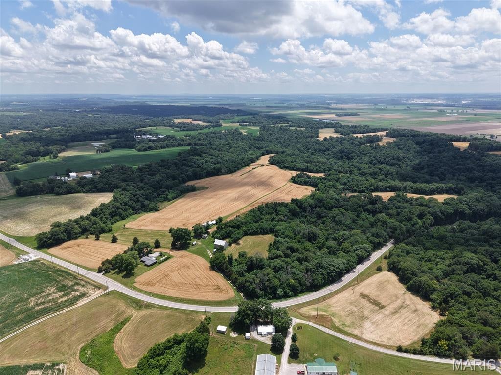 This 33 +/- acre property offers a nice mix of productive farmland and wooded ground, making it a great fit for a variety of uses. Approx 7+/- acres are quality tillable ground, while the remaining acreage is partially wooded, adding privacy, wildlife habitat, hunting, as well as other recreational opportunities.
The property includes a 100 +/- year old barn and a couple outbuildings that provides room to store equipment, tools, or farm supplies. Also, there is municipal water available. Whether you're looking to expand your current farming operation, start a small farm, invest in quality farmland, or simply enjoy a rural property with plenty of possibilities, this property is worth a look. Final acreage to be determined by survey.
An adjoining home on 2 +/- acres and an additional 76 +/- acre tract are also available for purchase, offering the opportunity to expand your acreage.