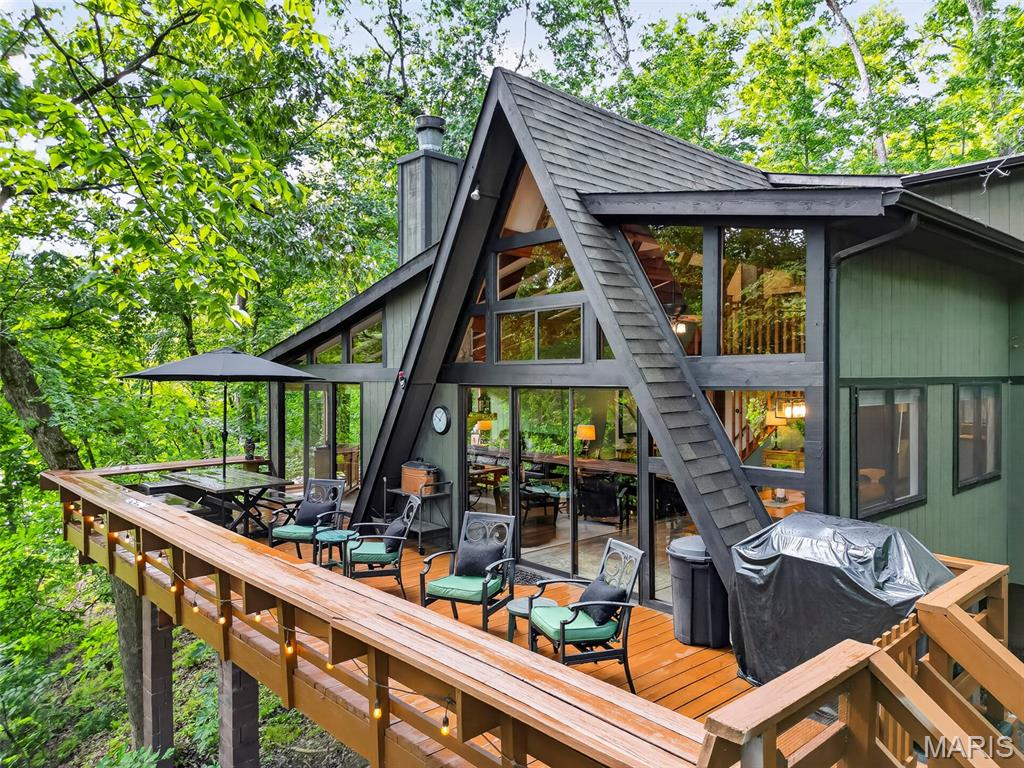 Wake Up to Lake Innisfree. This exceptional 3-bedroom, 2-bath A-frame is perfectly positioned along the shoreline, where beautiful lake views, peaceful surroundings, and the Innsbrook lifestyle come together. Inside, an expansive great room wrapped in windows brings the beauty of the outdoors in, creating a bright and inviting gathering space. A dramatic floor-to-ceiling stone fireplace anchors the room, complemented by a beautiful kitchen and generous dining area. The primary bedroom and full bath are located on the main level, while the upper-level loft features two additional bedrooms and a second full bath. Step outside to the spacious back deck with multiple seating areas overlooking the lake. Follow the path toward the water and discover a firepit area overlooking Lake Innisfree—the perfect place to gather, unwind, and enjoy evenings surrounded by nature. With its incredible lakefront setting, thoughtful spaces, and close proximity to all that Innsbrook has to offer, this is a property designed for making memories. Come see why life on Lake Innisfree feels a little different. See attached Rental history. This is a rental showings are limited don't miss the open house.  When going to 606 make sure to use Innisfree Circle Dr.  Do not come up Innisfree lake Dr.