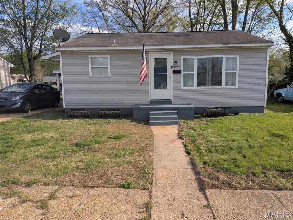 Located near the community center, local parks, and the fairgrounds, this efficient 1-bedroom home offers a practical layout with several recent updates. The interior features original hardwood flooring in the living room, bedroom, and the versatile bonus room, which is well-suited for a home office or additional sleeping area.

The eat-in kitchen has been refreshed with newly painted cabinetry and refinished countertops. All appliances, including the stainless steel refrigerator and stove, stay with the home. A dedicated main-floor laundry room provides added convenience, with the washer and dryer included in the sale.

The home is all-electric and utilizes radiant baseboard heat, supplemented by three window units and ceiling fans for cooling. Outside, the property includes a fully fenced backyard and a substantial 15x11 outbuilding. This shop space is equipped with a concrete floor, electricity, built-in cabinetry, a workbench, and shelving, providing excellent utility for storage or projects.

Please note: Property is being sold in its current 'as-is' condition. While the seller welcomes inspections for buyer's knowledge, no repairs or credits will be provided.  All information is deemed reliable but not guaranteed. Buyer to verify all information, including but not limited to room sizes, square footage, school districts, and taxes.  Outbuilding dimensions are approximate; buyer to verify.