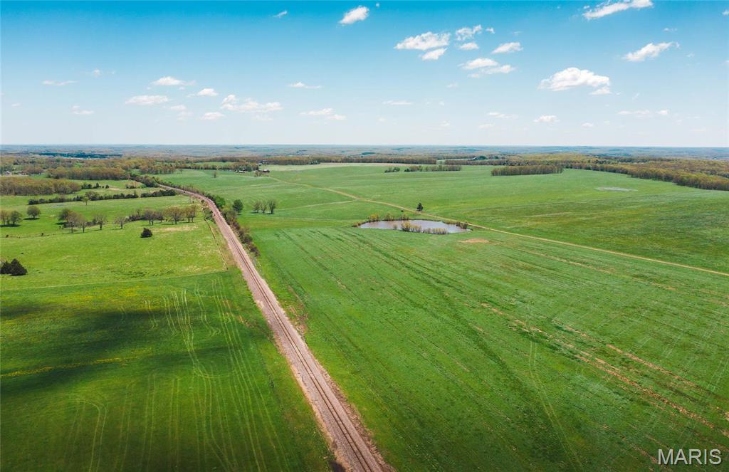 438.62 m/l acres between Rolla & St. James with CR 3290 frontage.  This property is open with mostly level, cleared and improved ground.  It offers industrial potential as well with over 5,500 m/l feet of the Burlington Northern Railroad running thru the property. Additional acreage available.