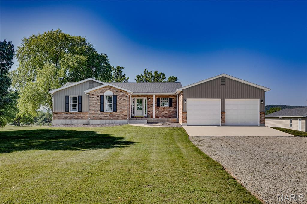 Situated on 4.34 picturesque acres in the Central School District, this beautifully updated 3-bedroom, 2-bath home offers the perfect blend of peaceful country living and modern convenience. Thoughtfully renovated over the past several years, this move-in ready property provides the space, updates, and versatility today's buyers are searching for.

The inviting open floor plan is filled with natural light and centers around a beautifully renovated kitchen featuring quality Shrock cabinetry, stainless steel appliances, and abundant workspace. The adjoining living and dining areas create an ideal setting for everyday living and entertaining. Just outside, a newly designed deck completed in 2025 stretches across the back of the home, providing incredible views of the surrounding acreage and the perfect place to enjoy morning coffee, evening sunsets, or gatherings with family and friends.

The home offers three spacious bedrooms, two updated bathrooms, and a convenient main-floor laundry room. Downstairs, the full walkout basement has already been plumbed for an additional bathroom, giving future owners an excellent opportunity to nearly double the finished living space while adding instant value. Whether you envision a recreation room, home theater, guest suite, office, or gym, the possibilities are endless.

One of the standout features of this property is the impressive insulated four-car detached workshop, complete with 220-volt electric and its own furnace. Whether you're a woodworker, mechanic, hobbyist, small business owner, or simply need room for recreational vehicles and equipment, this building offers endless possibilities and is a rare amenity that truly sets this property apart.

The 4.34-acre setting provides plenty of room for gardening, outdoor recreation, future improvements, or simply enjoying the privacy and serenity of country living while remaining just minutes from town.

Equally impressive is the extensive list of improvements already completed by the current owners, offering peace of mind for years to come. Major updates include a new HVAC system (2022), luxury vinyl plank flooring (2022), renovated bathrooms (2022), Shrock kitchen cabinetry (2022), new countertops (2022), stainless steel appliances (2022), fresh interior paint (2022), updated lighting and ceiling fans (2022), new roof (2023), new septic system (2023), new water softener (2023), concrete driveway approaches and walkway (2023), new garage doors (2023), HVAC duct cleaning (2024), a newly designed rear deck (2025), and a whole-house water filtration system (2026).

If you've been searching for acreage, a quality workshop, room to expand, and the confidence of knowing the major improvements have already been completed, this exceptional property is one you won't want to miss. Schedule your private showing today!