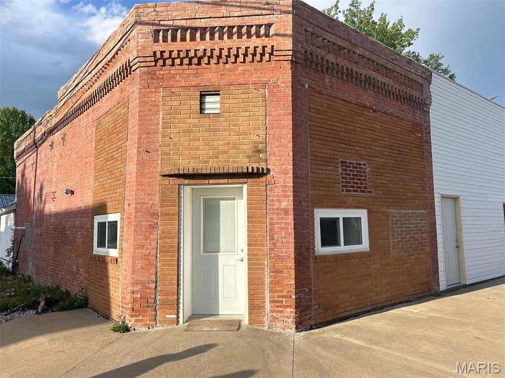 Brick building apartments right in the heart of Wayland, Missouri that date back into the 1900s! Each unit is 2,246 square feet with a single level.  One unit is 3-bedrooms and 1-bath while the other is 2-bedroom and -1-bath.  They were recently renovated with all new drywall, laminate flooring, cabinets, stove, refrigerator, bathroom, and new heating and air in one unit! Both apartments offer finished kitchens and living rooms for comfortable living and dining! Electric heating and air in Apartment B and natural gas furnace in Apartment A. Both apartments are currently rented and are move-in-ready without lifting a finger! Don't miss out on this beautiful investment property!