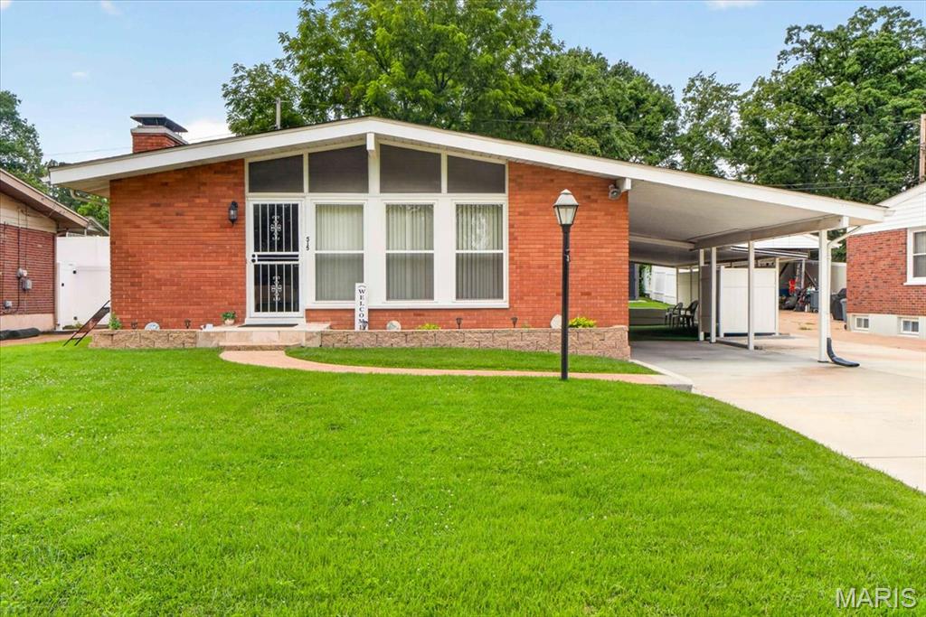 Welcome to **515 Marick Drive** in the highly desirable Rock Hill community! This exceptionally well-maintained home showcases true pride of ownership inside and out. From the moment you arrive, you'll be impressed by the beautifully manicured front and backyard, creating outstanding curb appeal and a peaceful outdoor setting.

Step inside to discover gorgeous hardwood floors that flow through the living room, dining room, and each of the bedrooms. The spacious living room is anchored by a cozy wood-burning fireplace, providing the perfect gathering space for family and friends. The kitchen is conveniently located adjacent to the dining area, while the secondary family room features attractive tile flooring, offering additional space to relax or entertain. The main floor bathroom also features beautiful tile flooring.

The generously sized bedrooms offer ample closet space, while the primary suite includes double closets and its own private full bathroom for added comfort and convenience.

Downstairs, the fully finished basement expands your living space with a large recreation room complete with an electric fireplace, a convenient half bathroom, and a spacious cedar closet ideal for storage.

Outside, you'll enjoy a large double carport and a tranquil backyard that's perfect for entertaining, gardening, or simply unwinding after a long day.

If you've been searching for a home that has been lovingly cared for, offers timeless character, and provides generous living space both inside and out, **515 Marick Drive** is one you won't want to miss!