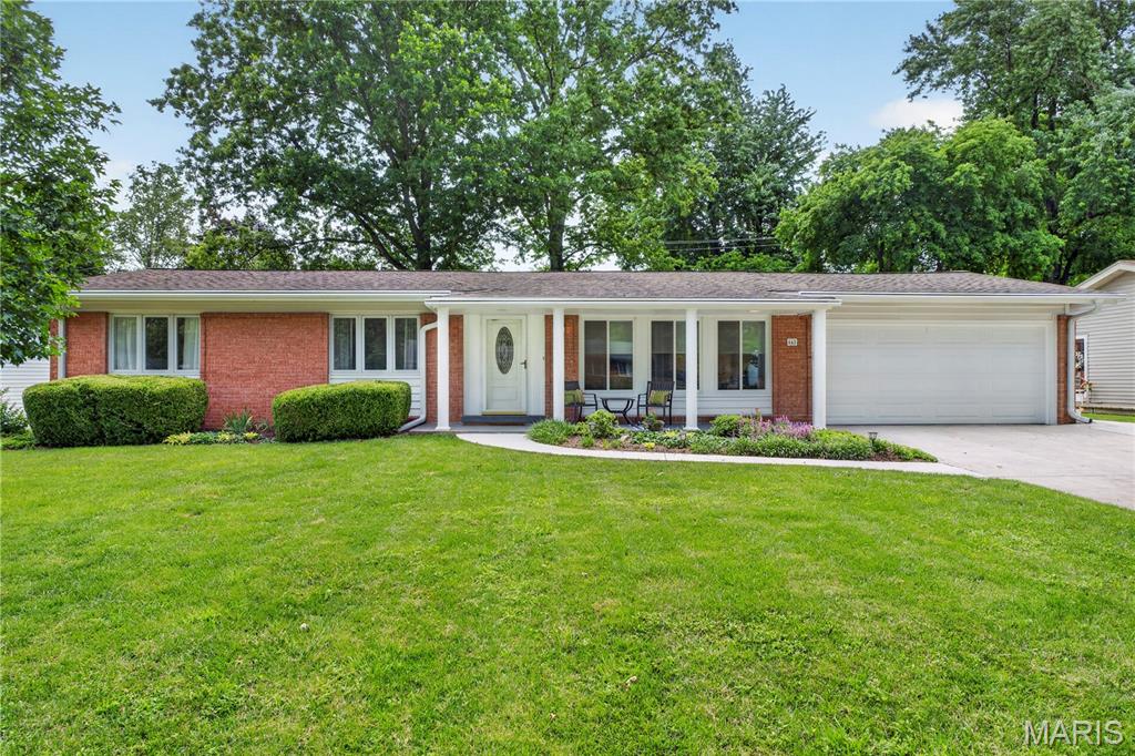 Some homes ask you to imagine what they could become. This one is already there.
Thoughtfully and meticulously renovated by its current owners, this Creve Coeur ranch in the highly sought-after Parkway School District — Parkway North High School — is move-in ready in every sense of the word. From the moment you step inside, the quality of every decision made during this transformation is immediately apparent.

The kitchen is the heart of this home and it earns that distinction. Custom cabinetry in Sherwin Williams Pool House Blue, stunning hexagonal tile backsplash, professional-grade stainless steel appliances all four years old or less, and gold hardware throughout — this is a kitchen designed to be used and admired in equal measure. The adjacent dining space is wrapped on three sides by windows, flooding the room with natural light and framing views of the beautifully landscaped backyard.

The primary suite accommodates a king-size bed with ease and features a fully updated en-suite bath with a floating vanity and a tiled walk-in shower. Two additional bedrooms on the main floor share an updated hall bath with new vanity, designer lighting, and a tiled shower and tub combination — finished with the same intentionality carried throughout the home.
One of the most inspired decisions the sellers made was converting the previous dining room into a dedicated mudroom and laundry space with direct access from the attached two-car garage. It is the kind of practical elegance that quietly transforms daily life — a place to prepare for the day ahead and decompress from the one behind you.

Step outside and the backyard delivers on the promise of the interior. A generous patio framed by mature landscaping and garden plantings creates a genuinely private retreat — a space where a long day simply begins to release.