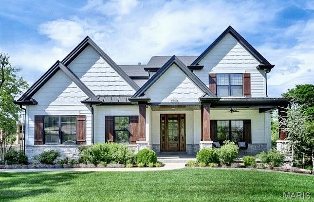Built in 2021, this elegant 1.5-story with almost 5000 square feet of living and entertaining area showcases distinctive design elements and thoughtful upgrades throughout. Wide-plank oak flooring, detailed trim work, transom windows, and an integrated sound system create a refined yet comfortable living environment. An impressive entry foyer welcomes you into a formal dining room and a stunning great room featuring a dramatic 12-foot box beam coffered ceiling and a floor-to-ceiling stone fireplace, beautifully flanked by custom built-in cabinetry. The designer kitchen is a true centerpiece, offering white Shaker cabinetry, quartz countertops, premium KitchenAid appliances, and an expansive 9-foot center island. It seamlessly connects to a light-filled breakfast room with a sliding glass door leading to a screened porch and adjacent deck—perfect for indoor-outdoor living. The main-floor primary suite serves as a private retreat, highlighted by a gorgeous double tray ceiling with accent lighting and a luxurious spa-inspired bath with an oversized shower and tub. Additional conveniences include a main-floor mudroom and laundry, plus a second laundry on the upper level. Upstairs, an oak staircase leads to three additional bedrooms—one with an ensuite bath and two connected by a Jack-and-Jill bath—along with a second family room and upper-level laundry. The walk-out lower level is ideal for entertaining or extended living, featuring a spacious media room, game room with patio access, second kitchen, fifth bedroom, and a private (sixth bedroom) guest suite. Since purchase, the owners have made meaningful investments in both comfort and peace of mind: the rear yard was professionally regraded with a custom retaining wall and landscaped to create a fully level and usable lot; Hunter Douglas motorized shades with remote controls were installed; and upgraded insulation for comfort. Located in sought-after Des Peres, this exceptional home blends elegance, functionality, and comfort in a truly beautiful setting. This home will go active in the computer on Wednesday, May 27th.