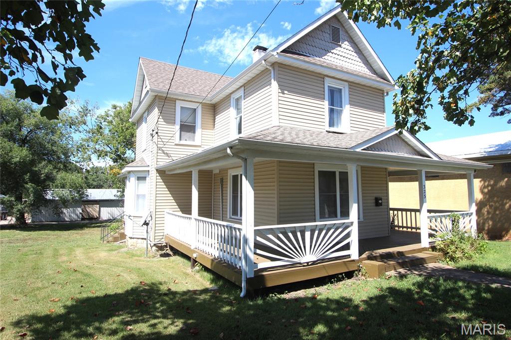 This two-story home offers a flexible layout with plenty of space to fit your needs. The main floor features a large living room, kitchen, full bathroom, and an additional room that could serve as a fourth bedroom, home office, or bonus space. Upstairs you'll find three bedrooms and another full bathroom. Hardwood flooring runs throughout most of the home, adding character and warmth. Outside, enjoy a large deck spanning the front and side of the home, along with a one-car carport in the back. Conveniently located in Bonne Terre, this home offers plenty of room and versatility.