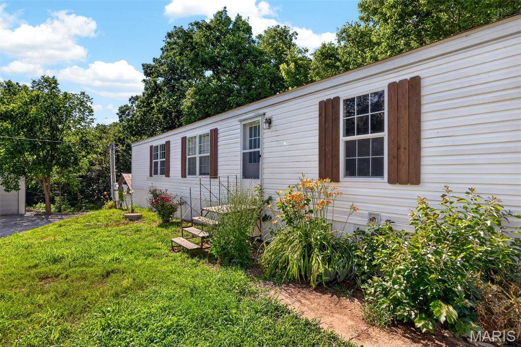 Welcome to your own peaceful slice of Lincoln County at 1203 Highway J. This home offers the perfect blend of country privacy and everyday convenience, situated on a private 1-acre lot with NO RESTRICTIONS!

Built in 2005, the property features a comfortable layout with 3 bedrooms and 2 full bathrooms. Outside, the standout feature is a massive 2-car detached garage, providing ample space for a workshop, vehicle parking, or extra storage.

Enjoy the freedom of a massive yard with plenty of room to grow, park your outdoor toys, or simply unwind in a quiet retreat, all while staying just minutes away from local Troy amenities. Whether you are looking for a peaceful country starter home or a quiet place to call your own away from HOA restrictions, this property is a must-see.