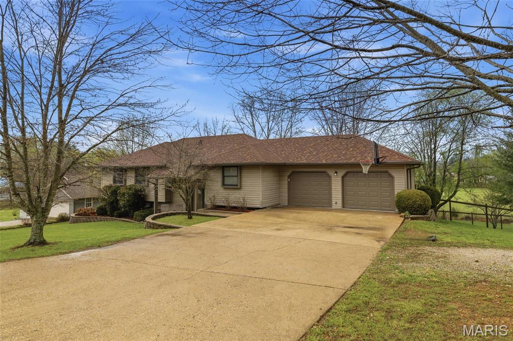If you are looking for a quality home with space and location, HERE IT IS!!!!!! Located in the Quail Run Subdivision of Willow Springs MO, this immaculate well-kept home offers 4 spacious bedrooms (including a 5th room that could be a non-conforming bedroom) and 3 full bathrooms. Main level includes 3 of the bedrooms, 2 full bathrooms, living room with high ceilings, kitchen with bar, cozy breakfast nook and a formal dining room. Step just off the kitchen to the amazing screened in porch/sunroom where you can relax and take in peaceful views of the adjoining land with NO backyard neighbors, just open space and peace. The lower level includes the fourth bedroom, full bathroom and additional room that could be used as non-conforming bedroom, office, gym space, storage or anything you can imagine! The second living area on the lower level is a HUGE family room that is 21x26 fully finished and ready for you to enjoy. This home offers the perfect balance of privacy and convenience with LOW TAXES just minutes from schools and local amenities. If you've been searching for a home that brings together space, comfort, and a true sense of family living, this one says it all.