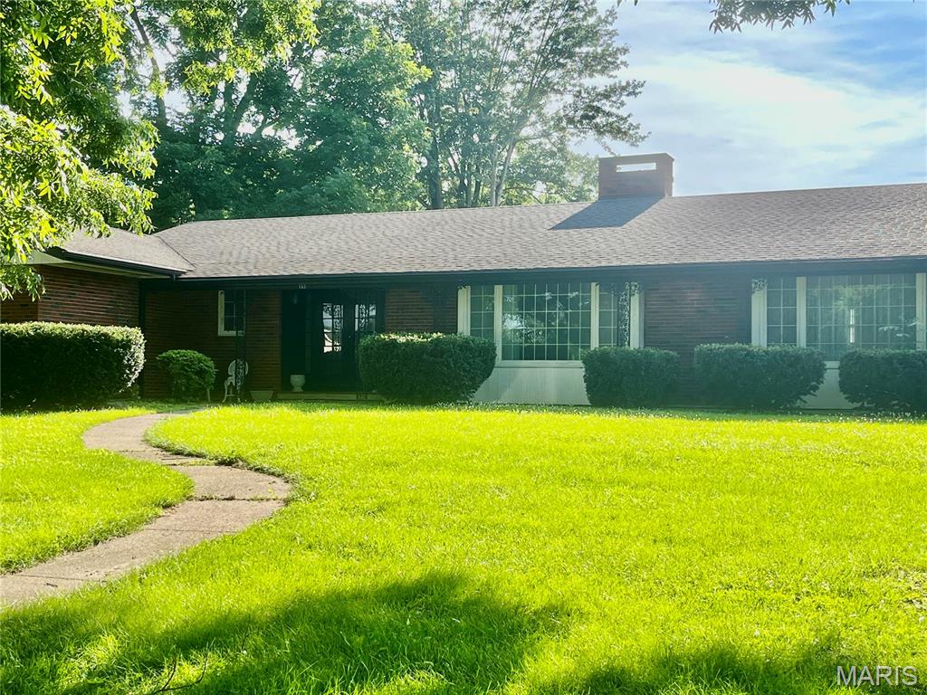 Welcome to this sprawling brick home located in beautiful, historic Clarksville. This property features mature shade trees and a large back yard. Once inside the foyer opens to a large entertaining area featuring a see through fireplace and a formal dining room. The kitchen has a breakfast bar that opens to a study with a fireplace, built-ins, and sliding doors that lead you to the outdoor patio.  Other features in the home include 4 spacious bedrooms and 2.5 bathrooms, plenty of closet space and a full unfinished basement.