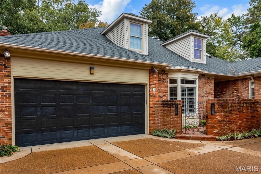 Elegant and timeless, this 5-bedroom, 3.5-bath Villa is gracefully tucked within a private enclave of just 18 homes in the highly sought-after Ladue School District. A charming brick patio framed by perennial gardens welcomes you to covered front entry, setting the tone for the refinement that awaits inside.
Gracious front entry with glass sidelights and a transom leads into a foyer of tall ceilings, classic moldings, and herringbone hardwood floors—embodying the home’s timeless elegance. Foyer boasts two large closets-one is a built-in custom wet bar with (new) wine fridge, lighting, sink, glass display and cabinetry. Formal dining room, overlooking front courtyard, offers plantation shutters and generous space for your gatherings. Spacious living room exudes warmth and elegance with its marble surround gas fireplace and French doors leading to a serene brick terrace, perfect for alfresco entertaining.
The main floor offers two exceptional en-suites. Primary suite is a true retreat, boasting two bay windows, built-in floor-to-ceiling bookcases and cabinetry, and a spa-inspired bath with a marble-topped vanity, ample linen closet, and custom tile shower with built-in bench and frosted glass enclosure. The walk-in closet feels like a boutique, complete with a built-in vanity, marble counters, shoe racks, and dressers. The second en-suite features floor-to-ceiling bookcases, private patio access, and a walk-in closet. Second ensuite bathroom is thoughtfully converted to include a convenient main-floor laundry area, blending comfort with practicality.
Gourmet kitchen delights the culinary enthusiast with walk in pantry, high-end cabinetry boasting soft-close drawers and heavy duty drawer glides. Two fridge/freezer built in drawers (next to refrigerator), granite counters, convection wall oven with Wolf microwave, Sub-Zero built-in refrigerator, built-in dishwasher and built in ice maker. Viking stainless steel range hood crowns the 5-burner gas cooktop set in oversized center island, surrounded by abundant counter space and under cabinet lighting, all designed for both form and function. Open plan flows seamlessly into breakfast area and family room, featuring floor-to-ceiling bookcases, recessed lighting, TV shelf, a gas fireplace, and two sets of French doors opening to the generous sized brick patio—a perfect setting for casual gatherings and relaxed indoor-outdoor living.
Upstairs, two spacious bedrooms, both with walk-in closets, share a dual-sink bathroom graced with a skylight. Bathroom has new lighting, fixtures, paint, vanity and mirrors. Hallway boasts two large linen closets and attic is easily accessible from hall and spans the entire frontage of home. 
The partially finished lower level beautifully extends the home’s living space, offering versatility for every lifestyle. A fifth bedroom shows off custom bunk beds, a flexible room can used for media, fitness, playroom or office area, while a dedicated craft and hobby room features ample cabinetry, recessed lighting, and a walk-in closet—an ideal retreat for creative projects or workshop pursuits. A full bath with tile flooring and a glass-enclosed shower is conveniently located by 2nd laundry area for added functionality.
An under-stair wine cellar with removable wine rack, adds a touch of charm and sophistication, while three additional storage closets, including two with floor-to-ceiling deep shelving, ensure every belonging has its place as you make your move to Upper Price. Attached two-car garage with 4 storage closets, completes this remarkable villa residence. Ideally situated in Olivette, moments from shops, dining, parks, and groceries, this home perfectly balances timeless elegance with modern ease—a refined sanctuary in one of St. Louis’s most desirable communities on private street. By Appointment only.