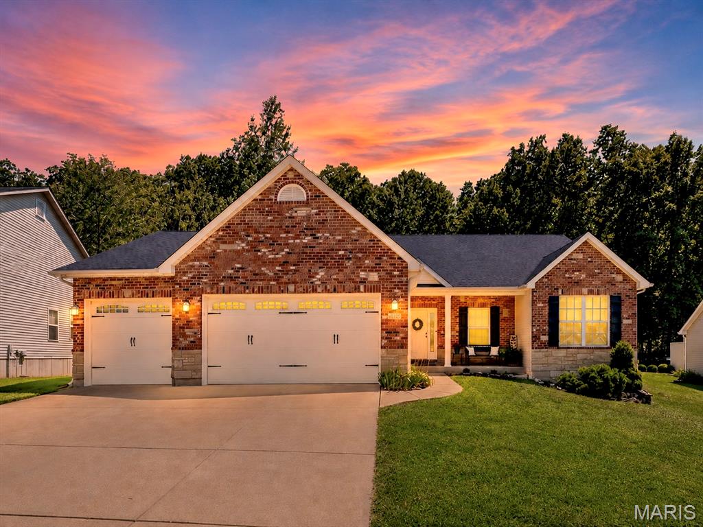 Welcome home where timeless style, thoughtful updates, and a peaceful wooded setting come together in one exceptional property. From the moment you arrive, you'll appreciate the impressive curb appeal featuring beautiful brick and stone accents, manicured landscaping, sidewalks throughout the neighborhood, and an oversized extra-deep three-car garage offering plenty of room for vehicles, storage, and hobbies.

Step inside to a spacious vaulted great room filled with natural light from the charming bay window. A striking brick gas fireplace creates the perfect focal point for relaxing evenings or entertaining guests. The adjoining kitchen is designed for both everyday living and hosting, featuring granite countertops, a breakfast bar, pantry, 42-inch custom cabinetry with crown molding, and convenient access to the main-floor laundry room. The sunny breakfast room is surrounded by windows and opens through French doors to a covered deck overlooking a serene, fenced backyard that backs to mature woods—offering privacy and a peaceful place to enjoy your morning coffee or unwind after a long day.

The spacious main-floor primary suite is a true retreat with vaulted ceilings, a bay window, walk-in closet, and a luxurious ensuite bath complete with dual vanities, a soaking tub with decorative plant shelves, and a separate shower. Two additional main-floor bedrooms and a full hall bath provide comfortable accommodations for family, guests, or a home office.

The finished lower level expands your living space with a large recreation room perfect for movie nights, game days, or entertaining. You'll also find a fourth bedroom with an egress window and closet, a full bathroom, plus abundant unfinished storage space.

Recent updates provide added peace of mind, including a new roof (2025), newer water heater (2019), and fresh interior paint and brand-new carpet installed in July 2026.

Conveniently located just minutes from Gravois Bluffs, Arnold Commons, shopping, dining, parks, and major highways, this beautiful home is also served by the highly regarded Fox C-6 School District. Combining a desirable location, functional floor plan, modern updates, and a private wooded setting, this move-in ready home offers everything today's buyers are looking for. Schedule your private showing today and discover why 1132 Konert Valley Drive is the perfect place to call home.