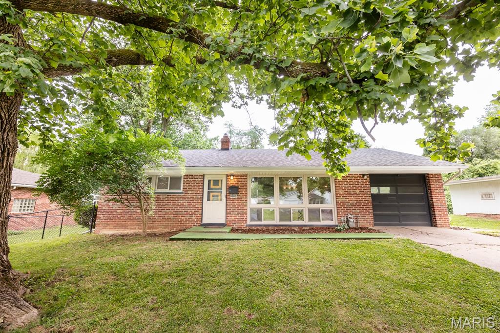 Chances like this don't come around often! This charming full-brick ranch offers the perfect combination of affordability, character and modern updates. Featuring 2 bedrooms, 1 bathroom, and a mostly finished basement, this home provides more living space than meets the eye. Step inside to find a bright and inviting living room highlighted by a wall of windows that fills the space with natural light. The updated kitchen offers a fresh, modern feel while maintaining the home's classic charm. Downstairs, the mostly finished basement provides the perfect space for a family room, home office, recreation area, or additional entertaining space. Outside, you'll love the huge fenced backyard with plenty of room for pets, gardening, outdoor gatherings or simply enjoying the shade of the mature trees. A covered deck adds additional space to relax and unwind. Whether you're a first-time homebuyer, looking to downsize, or searching for an affordable move-in ready option, this well-maintained home checks all the boxes. Don't miss your opportunity to make this charming ranch your own!