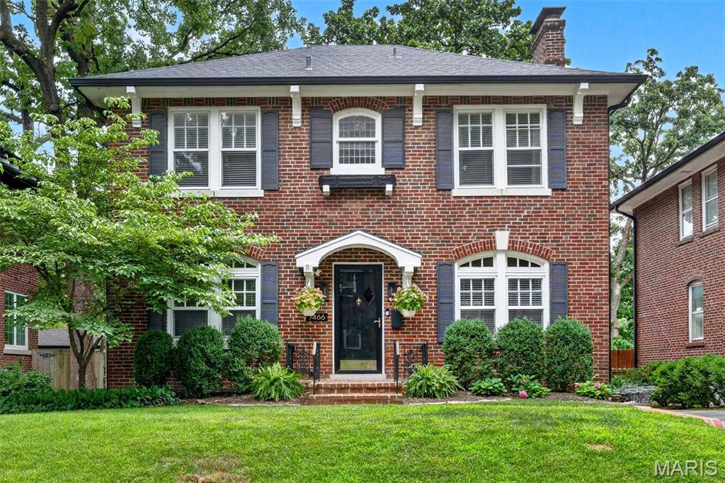 Welcome home to this stately residence with timeless curb appeal, perfectly situated on a picturesque tree-lined street in the highly sought after Alta Dena neighborhood. Rich hardwood floors and classic millwork flow throughout, creating an elegant yet inviting atmosphere. The spacious living room features a stunning fireplace, making it the perfect place to relax or gather with family and friends.

The beautifully appointed kitchen offers timeless style with crisp white cabinetry, black granite countertops, stainless steel appliances, and an adjoining dining area bathed in natural light. A convenient half bath completes the main level.

Upstairs, the generous primary suite features two large closets, while two additional bedrooms each include walk-in closets, providing exceptional storage. A full bath completes the upper level.

Step outside to your own private retreat. The beautifully landscaped, fenced backyard offers a covered deck that overlooks a charming brick paver patio and plenty of green space for gardening, play, or outdoor entertaining. A detached two-car garage provides convenience and protection from the elements.

Ideally located within walking distance of U City's vibrant shops and restaurants, this home also offers easy access to Clayton, Forest Park, Wash U, and major highways including I-64/40 and I-70. This is a wonderful opportunity to enjoy classic charm, modern comfort, and an unbeatable location.