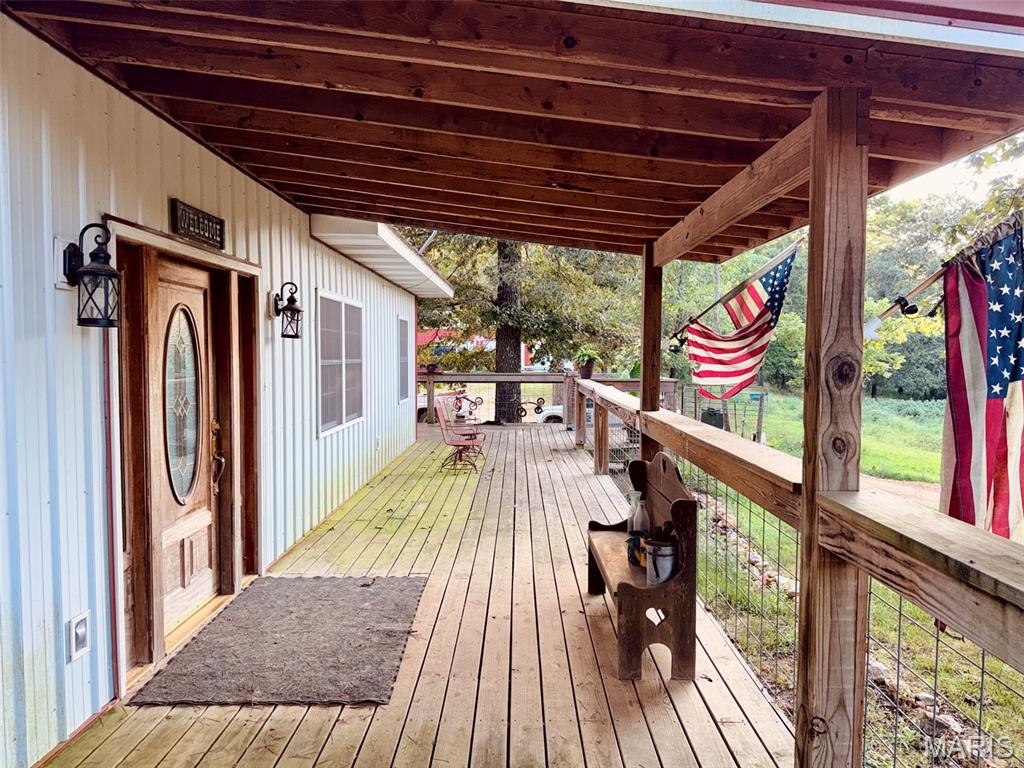 3000 ft all-electric home with open concept, built in 2020 with partial walkout unfinished basement and floor drain. Wrap-around deck, 30x60 four-stall horse barn, and 30x60 three car garage/Workshop with stubbed-in bathroom both built by Crafton. The perimeter of the property has a hot wire fence. Sits on nine and a half acres just north of Poplar Bluff.