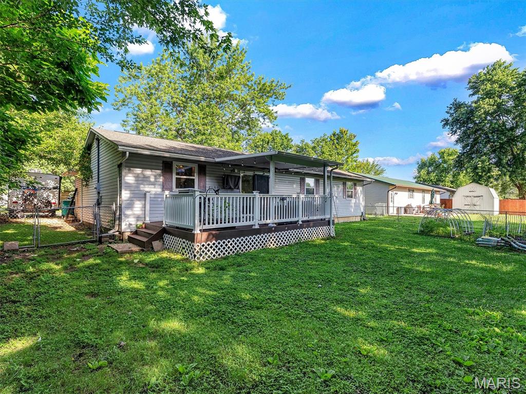 Welcome home to this beautifully updated 3-bedroom, 1-bath ranch nestled on a quiet dead-end street in one of Sullivan's most desirable neighborhoods. Offering a spacious and functional floor plan, this home features a large kitchen and dining combination with plenty of room for family meals and entertaining, along with an oversized living room that provides a warm and inviting gathering space.

Recent updates include a new HVAC system, giving buyers peace of mind and improved energy efficiency. Step outside and enjoy the stunning covered deck, perfect for relaxing with your morning coffee or hosting friends and family. The spacious fenced backyard offers plenty of room for children, pets, gardening, or outdoor activities.

Complete with a 1-car garage, attractive curb appeal, and a convenient location close to schools, shopping, and amenities, this move-in ready home combines comfort, updates, and value. Don't miss your opportunity to make this wonderful property your own!