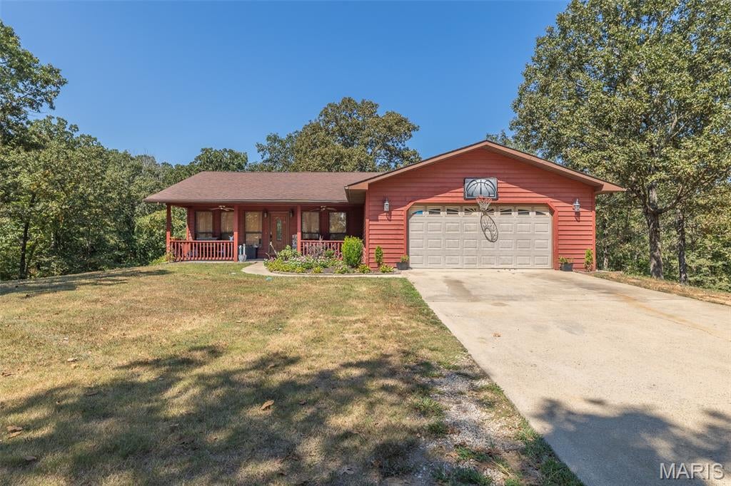 A rare find that truly checks all the boxes! This recently remodeled 4-bedroom, 2-bath home offers the possibility of a 5th bedroom and is beautifully situated on 3.64± park-like acres, providing the privacy, seclusion, and country setting you’ve been looking for while remaining conveniently close to everything Poplar Bluff has to offer. Located outside city limits with easy highway access and just minutes from Lake Wappapello, this move-in-ready property delivers an exceptional combination of location, space, and versatility. Inside, you’ll find modern colors and finishes throughout, a beautiful custom kitchen, generously sized rooms, ample storage, and a fully finished walkout basement offering substantial additional living space. A dedicated movie theater room complete with projector creates the perfect space for entertaining or relaxing at home. Outside, enjoy beautiful views and peaceful surroundings from the grand rear patio or expansive rear deck overlooking the secluded acreage. An oversized two-car garage provides additional space for vehicles, storage, or hobbies, while a 30’ x 40’ shop base is already in place and ready for the construction of a future shop or outbuilding. Adding even more character to this exceptional property is a recently added, professionally constructed treehouse that is included with the sale. With multiple living areas, flexible bedroom options, impressive outdoor spaces, acreage, privacy, and a location convenient to both Poplar Bluff and Lake Wappapello, properties offering this much are increasingly difficult to find.