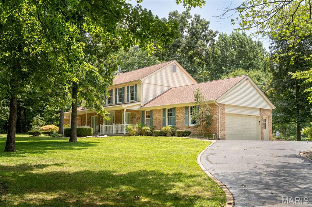 One of a Kind!! This well maintained home is ready to be loved by a new owner with SO much to offer!  An incredible 5 bedroom home, with room to spread out, is situated on 3 peaceful acres that also includes an awesome barn-type building w/loft workshop space...WOW!!  The primarily-brick home welcomes you with a covered front porch to enter into the foyer featuring shiny wood floors that flow into the front sitting/formal LR as well as the comfy living room w/woodburning fireplace, flanked by built-ins, plus a big bay window that looks out to the shaded park-like backyard!  Step into the kitchen where everyone will want to gather with glass-front cabinetry, solid surface countertops, pantry plus a nice space for your table to share meals.  Celebrate your holiday meals together in the formal DR w/hardwood floors & large windows for great natural light!  A custom, open-style ceiling is found in the massive primary bedroom, a perfect retreat at the end of the day, as it offers a bay window for a quiet sitting area, an ensuite bath complete with jet tub, step-in shower, 2 separate vanities, private water closet plus large walk-in closet!  Upstairs, everyone will have their own space with 4 large bedrooms offering great closet space, fans & lots of natural light from big windows!  One of these bedrooms also includes an ensuite bath so would work great for guests or as an in-law suite!  Need a place for fun and games?  Check out the inviting family room to enjoy a game of pool or relax at the end of the day!  Main floor laundry, large garage with epoxy floor and a huge storage room that includes cabinets and shelves completes this amazing home!  Step out to the screened porch from the kitchen to enjoy a cup of coffee as you watch the birds or deer or just enjoy the peace & quiet of this private yard!  The huge barn-building (48x36), with drive through capability, features a concrete floor in the main section w/loft that's set up as a workshop...any man's dream space!  An additional section is perfect for parking your RV or a boat while the lean-to, on the other side, gives you so many options, too!  An adorable playhouse will be loved by kids, as well!  Get ready to enjoy this quiet, tucked away neighborhood in a great location as it's close to schools, shopping and I-44 access!  This amazing home and property is move-in ready!  Don't miss this opportunity!  Make this your home TODAY! 
**Restrictions for neighborhood are available for review.  HOA is $300 a year with proposed increase to $500 in 2027.  Special Assessment for re-pavement of the subdivision road is $300 a year for an additional 5 years.  Buyers to assume this yearly Special Assessment**