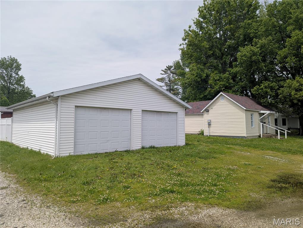 Let's stop pretending the house is the star here. The real headliner is the garage.

Oversized, generous, ample: no matter what you call it, we all know that in some things, SIZE MATTERS. And this garage understands the assignment. 

The detached 24x28 oversized 2-car garage is easily one of the most valuable features on the property. There’s room for vehicles, tools, hobbies, lawn equipment, storage, projects, weekend tinkering, questionable Facebook Marketplace purchases, and probably still enough leftover space to actually park. Plus it sits on a huge corner lot that just happens to have a "project house" on it as well.

About that house… she’s not winning any beauty contests right now. This 2-bedroom, 1-bath, 740 sq ft home is mid-renovation, and the seller chose not to waste time or money throwing a little paint around just to make things look better for photos. No lipstick on a pig here. What you see is what you get. But here’s the good news: a lot of the big stuff is already done.

Electrical has been updated with up-to-date wiring and a new breaker panel. New plumbing has been run throughout most of the house, with just a couple final connections left to complete (the washer/dryer closet and kitchen hot water line). The space-conscious bathroom is about 90% finished with its glow-up, replacement vinyl windows are already installed, the water heater is only 3 years old, and the roof on the house was replaced just 2 years ago. 

Inside, the living room and one bedroom floors have already been stripped and sealed, giving you the option to continue the restoration or install something fresh. The old furnace has been removed, and the seller is providing a window a/c unit and 2 heaters to keep you comfy while you decide what kind of HVAC system to install in your new tiny kingdom.

This property is perfect for an investor looking for a manageable renovation, a buyer ready to finish what’s been started, or someone who believes garage space counts as living space. Or for someone who is tired of paying for storage units, perhaps?

Bring your vision—and maybe a little elbow grease.