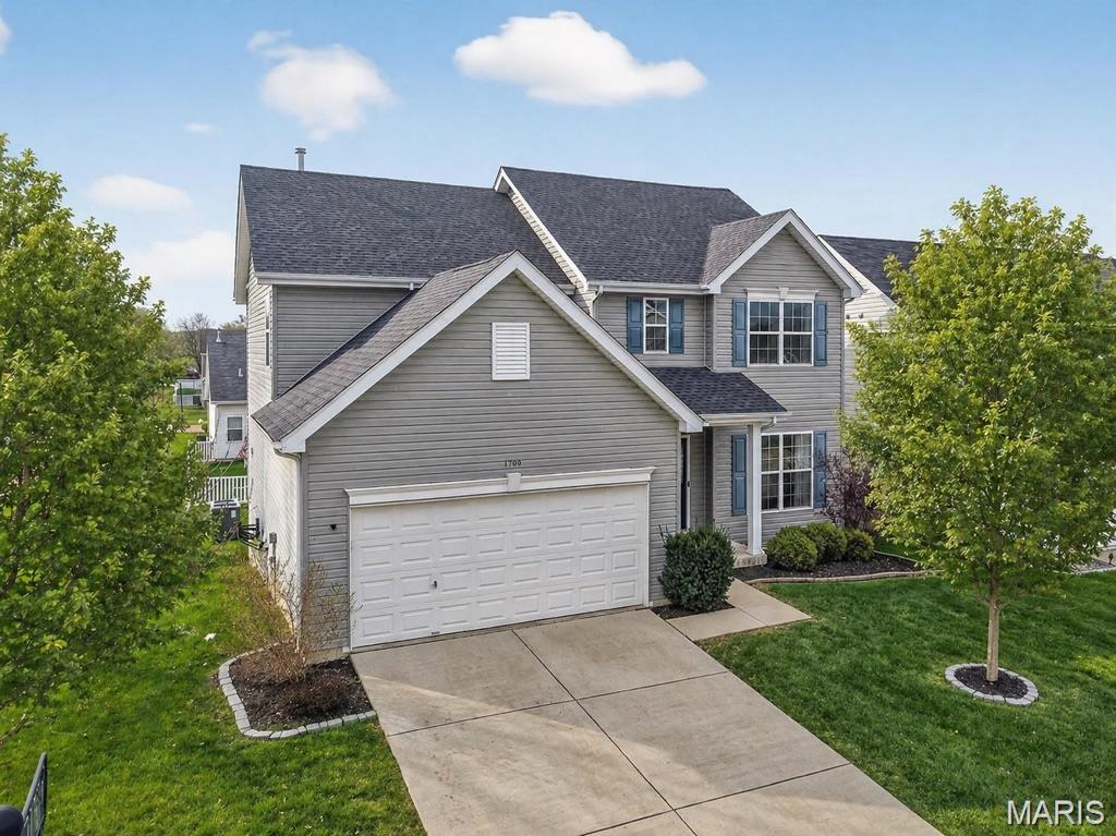 Welcome to a home where everyday moments feel just a little more extraordinary. Nestled in Wyndgate, life settles into an easy rhythm—summer afternoons at the pool and splash pad, evening strolls along tree-lined trails, and weekends filled with laughter at the park.

Step inside and you’ll feel it immediately: beautiful engineered wood floors underfoot, soaring ceilings above, and sunlight streaming through every window. Each space is designed to invite you in, encouraging you to slow down and stay awhile.

At the heart of the home, the kitchen shines with custom cabinetry, granite countertops, stainless steel appliances, and an oversized island that naturally becomes the gathering place. Whether it’s morning coffee in the breakfast room or cozy evenings by the fireplace, this home is built for connection.

There’s room for every part of life—quiet mornings in a private office/den, elegant dinners in the dining room, and celebrations that flow effortlessly from one space to the next. Upstairs, the primary suite offers a peaceful retreat, complete with a spa-inspired bath designed for unwinding. Thre additional bedrooms, all with walk-in closets, provide comfort and space for all.

The finished walkout lower level expands your possibilities—perfect for movie nights, game days, guests, or simply spreading out, with a private bedroom and full bath (with walk in shower) for added convenience.

Outdoors, the setting is just as inviting. A newer, expansive composite deck overlooks a level yard, while the extra-large patio below creates the perfect backdrop for entertaining, dining under the stars, or enjoying a quiet evening.

With well-appointed features like dual HVAC and an EV charger, and everyday conveniences just minutes away, this home goes beyond expectations—it creates a feeling.

More than a place to live, this is where your next chapter begins.