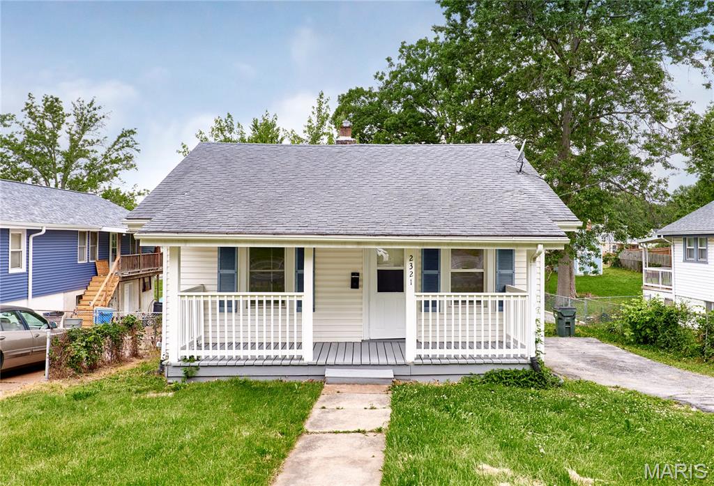 Beautifully renovated 2 bed, 1 bath home featuring a brand-new kitchen with stylish cabinets, stainless steel appliances, and a charming breakfast area. The home also offers an updated bathroom, new LVP flooring, fresh paint throughout, updated light fixtures, vinyl windows, and a brand-new HVAC system for year-round comfort. Enjoy relaxing on the inviting front porch, entertaining in the spacious backyard, and the added convenience of a walkout basement with plenty of storage space.