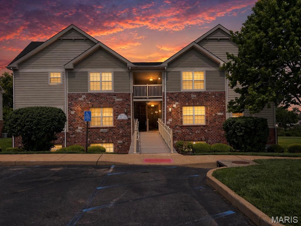 Welcome home to easy, low-maintenance living in the highly sought-after Francis Howell School District! This inviting 2-bedroom, ground-level condo offers the perfect blend of comfort, convenience, and lifestyle. A welcoming entry foyer leads into a spacious, centrally located living room ideal for relaxing or entertaining with family and friends. The large eat-in kitchen features ample custom cabinetry, a pantry, and direct access to your private covered patio, where you can unwind while enjoying peaceful views of the expansive common ground and walking path. The generously sized primary suite provides a comfortable retreat with direct access to the full bath, while the split-bedroom layout offers added privacy with a well-proportioned second bedroom. Enjoy the ease of in-unit laundry and a huge walk-in storage/utility room just off the foyer, plus an additional exterior storage space for all your extras. An assigned covered parking space and abundant guest parking add to the convenience, while the scenic subdivision lake enhances the community’s charm. Whether you're starting out, downsizing, or simply seeking stress-free living, this move-in-ready condo is one you won’t want to miss!