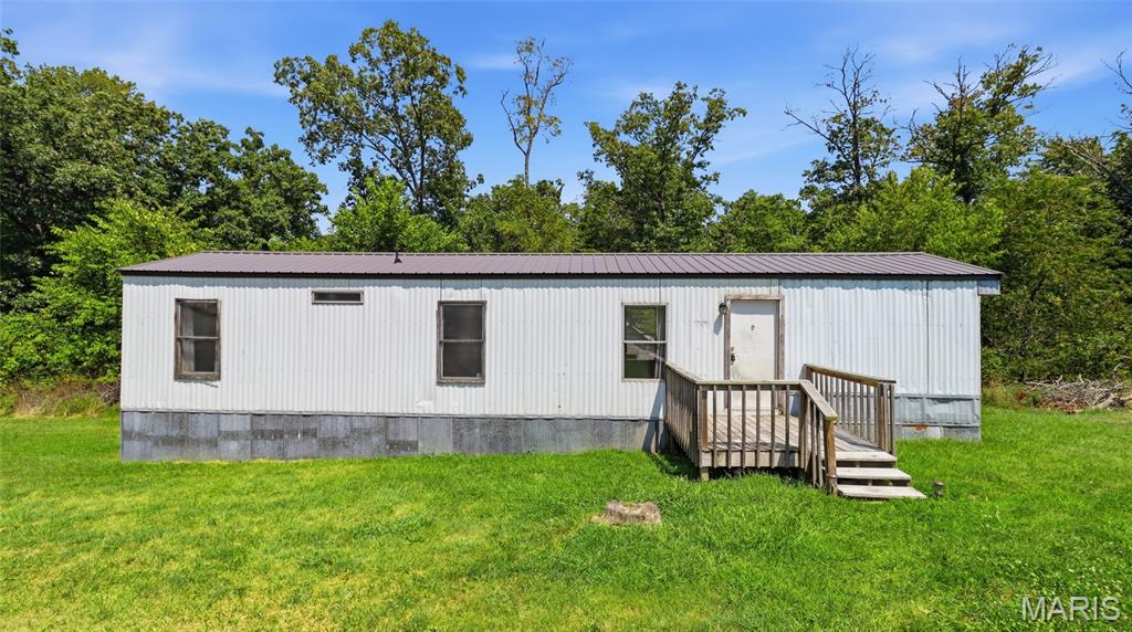 Discover the possibilities with this 2-bedroom, 1-bath manufactured home situated on nearly 2 acres in a peaceful, secluded setting. Located just 1 mile from the Big Piney River and Boiling Springs Access and Resort, featuring a store, restaurant, and bar, this property puts some of the area's best outdoor recreation right at your fingertips. Surrounded by the natural beauty of the Ozarks and conveniently located near Mark Twain National Forest, outdoor enthusiasts will appreciate easy access to opportunities for fishing, floating, hunting, hiking, exploring, and enjoying the Missouri countryside. Whether you're looking for a weekend escape, full-time residence, or investment property, the location offers plenty of possibilities. Tucked away from the hustle and bustle, the property provides privacy and nearly 2 acres of space to enjoy. There’s room for outdoor activities, gardening, pets, or simply relaxing and taking in the peaceful surroundings. A new roof adds valuable peace of mind and is one less major improvement for the next owner to worry about. Inside, the 2-bedroom, 1-bath layout offers a manageable footprint with plenty of potential to personalize the space. With its proximity to the Big Piney River, Boiling Springs Access and Resort, and Mark Twain National Forest, this property could make an appealing rental, recreational getaway, or affordable country home. Schedule your private showing today and discover everything this location has to offer!