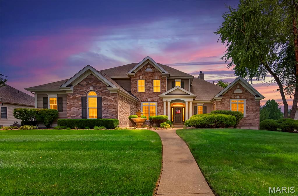 Welcome to this stunning story-and-a-half home, thoughtfully designed with an open floor plan, exceptional craftsmanship, and incredible spaces for everyday living and entertaining. From the moment you enter, you’ll appreciate the custom details, soaring ceilings, abundant natural light, and beautifully updated finishes throughout.

The main level features a 2 story great room with wall of windows, hardwood flooring, gas fireplace, and built ins.  Step into spacious primary suite with a luxurious master bath, complete with a separate soaking tub and walk-in shower. The updated kitchen is truly a chef’s dream, showcasing quartz countertops, a gas cooktop, double ovens, and double dishwashers—perfect for both everyday meals and entertaining.

The vaulted hearth room offers a warm and inviting gathering space centered around a gas fireplace.  A formal dining room and separate den/office with gorgeous built in bookcases  provide additional versatility, while the main-floor laundry adds everyday convenience.

Upstairs, you’ll find three generously sized bedrooms. One bedroom offers a private en-suite bath and walk in closet, while the other two share a spacious Jack-and-Jill bathroom, providing comfort and privacy for family or guests. All three are separated by a spacious loft area overlooking great room 

The fully finished walkout lower level takes entertaining to another level, featuring a large family and recreation area, full wet bar, dedicated theater room, workout room, built in sauna and convenient half bath. With direct walkout access, this level seamlessly connects the indoors with the incredible outdoor living spaces.

Step outside to an amazing lot designed for entertaining and enjoying the outdoors. The maintenance-free deck provides the perfect spot for morning coffee or evening gatherings, while the large covered patio below offers additional year-round living space. A full-size shed provides excellent storage, and custom landscaping enhances the beauty and privacy of the property. Mature trees and professional lanscaping around the entire home. 

Completing this exceptional home is a side-entry three-car garage, offering plenty of room for vehicles, storage, and more. Make your appointment today .