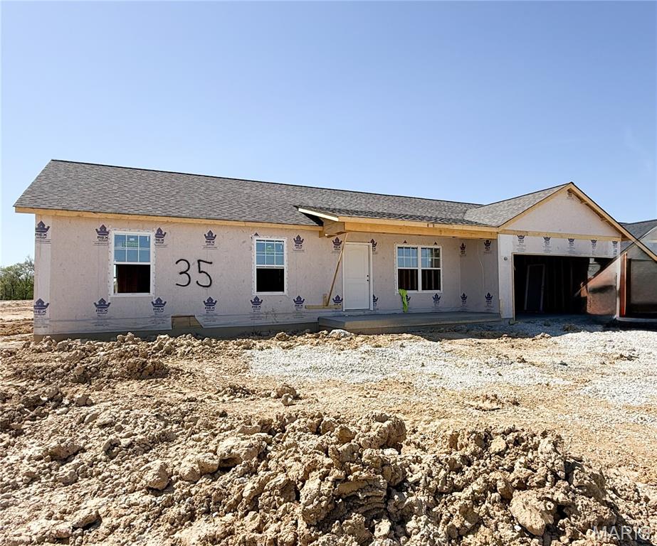 USDA No Money Down Territory! Just 7 Miles from Wentzville! Sales price is final price. Under Construction on level lot 35 of The Shire.  The Aspen Model Boasts 3Bed/2Bath Open Floor plan. Enter in to the Great Room with Vaulted Ceilings and a Ceiling Fan. In the Kitchen you will find Grey Shaker Cabinets, Granite counter tops with 60inch eat-in Island. The Kitchen sink overlooks the backyard. Stainless Steel Appliances and Recessed Lighting in the Kitchen. The Master Suite includes an oversized closet, ceiling fan, Plenty of natual lighting and on-suite bathroom with a Step-In Shower. Other Interior Upgrades include Upgraded Flooring, Tilt-in Windows, 2 Panel Doors with Black Hardware, Black finish Light Fixtures & Black Plumbing Fixtures. Full Basement W/ Egress Window, Sump-Pump, and Rough-In Bath. The Exterior includes 10x13 Covered Patio, Covered Front Porch, Architectural Shingles, Maintenance-Free Vinyl Siding with Shake Accent, and Fresh Sodded Front yard. Full sized 2 car garage with extra depth making it 24ft deep to fit those oversized pick ups. In the Garage you will also find a service door that leads to your covered patio. To be Completed at the beginning of June! Schedule your Appointment to walk through this home and see color selections.