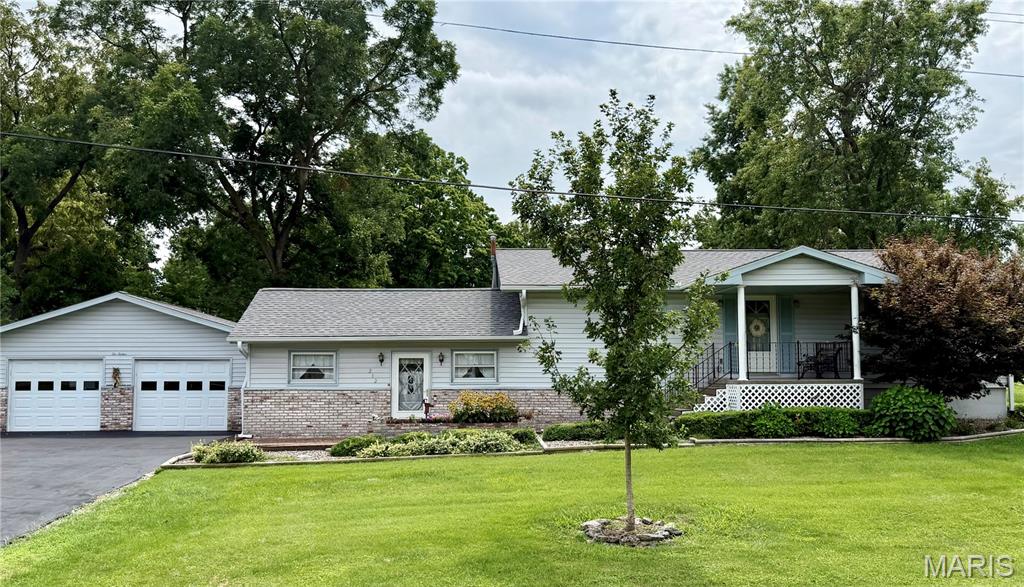Welcome to this well-maintained 3-bedroom, 2-bathroom, tri-level home on a beautifully landscaped corner lot. This unique home features a versatile tri-level design with generous room sizes and multiple living areas, making it ideal for everyday living and entertaining.  The heart of the home is the oversized eat-in kitchen with abundant cabinetry and room for a large dining table. Upstairs you’ll find spacious bedrooms, while the lower level offers both a living room and family/rec room, creating the perfect spaces for movie nights, hobbies, or gatherings. The detached two-car garage is conveniently connected to the home by a covered breezeway, providing protected access and additional outdoor living space. An additional storage shed is included for all your outdoor equipment. Relax on the covered porch or enjoy the peaceful backyard setting. This home has been lovingly cared for over the years and offers an incredible opportunity to move right in while adding your own personal updates. With its functional layout, abundant storage, and convenient location, this property is one you won’t want to miss!