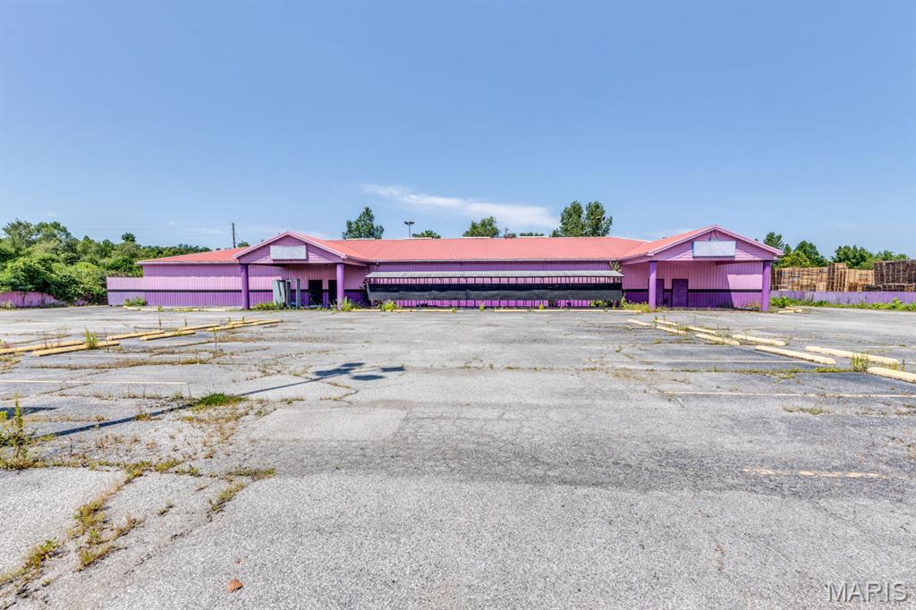 Exceptional redevelopment and owner-user opportunity in East St. Louis! Situated on a sprawling 3.43± acre commercial parcel, this versatile 10,080± square foot building, constructed in 1996, offers outstanding visibility, ample parking, and endless possibilities for a variety of business ventures subject to local municipal/governmental approvals. Formerly operated as an entertainment venue. The flexible floor plan lends itself to numerous potential uses. The paved and striped parking lot accommodates approximately 185 vehicles and is complemented by monument signage for enhanced exposure. Conveniently located near major transportation corridors and approximately one mile from Touchette Regional Hospital, this property offers a unique combination of size, functionality, and redevelopment potential. The property falls under the zoning jurisdiction of Cahokia Heights, and any proposed use not currently permitted by applicable zoning regulations will require approval from the City of Cahokia Heights. Buyer to independently verify zoning, permitted uses, and all property information.