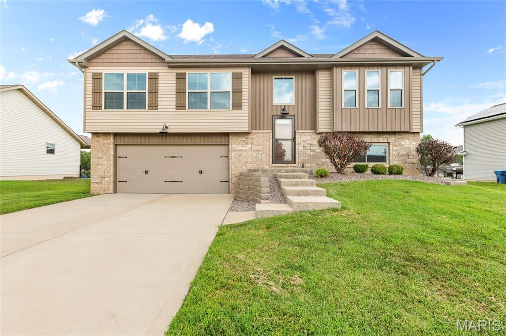 Meticulously maintained 4-bedroom, 3-bath home located in the highly sought-after Meadows of St Jacob! Step inside to a bright, welcoming interior featuring a neutral color palette, gleaming luxury vinyl plank flooring, and an abundance of natural light throughout. The tastefully designed kitchen features upgraded cabinetry, granite countertops, stainless steel appliances, center island, pantry, and an upgraded lighting package that continues throughout the home. The spacious primary suite offers a private bath with dual vanities and a walk-in closet. Two additional bedrooms and a full bath complete this main level. Step outside and enjoy the spacious covered deck, perfect for relaxing or hosting BBQ's rain or shine! The finished walkout lower level provides even more living space with a generously sized family room, 4th bedroom, full bathroom and large laundry room. Walk out to the patio for additional outdoor living and entertaining space. Additional features include a two-attached garage and a wonderful setting in this charming lake neighborhood within the Triad School District. This beautifully maintained home is truly move-in ready. Call today for your personal tour!