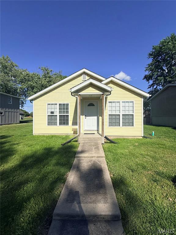 Back on the market! No Fault of Seller, Buyer had a family emergency. 
Welcome home to this beautifully maintained newer construction in Gillespie! Built in 2019/2020 on the existing crawl space, this move-in ready 3 bedroom, 1 bath home still shows like new. The open floor plan offers a spacious feel perfect for everyday living and entertaining. Kitchen features cherry-toned cabinetry, quartz countertops, stainless steel appliances, and ample storage. Durable flooring throughout includes laminate, ceramic tile, and waterproof luxury vinyl. Spacious primary bedroom offers dual closets, and the full bath includes a ceramic tile tub surround. Exterior water lines have also been updated. Low property taxes make this home even more affordable. A perfect option for first-time buyers, downsizers, or anyone looking for low-maintenance living! Crawl space just had a new vapor barrier installed as well as a new wall on one side of the house. Call your favorite agent and get on over!