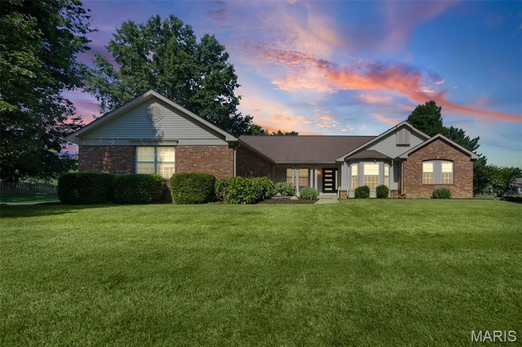 **Welcome to The Manors of Woodfield, where this beautifully updated modern ranch home offers 4,558 square feet of exceptional living space on over an acre, blending luxury, comfort, and resort style living.** From the moment you step inside, you'll appreciate the stunning Acacia hardwood floors that flow throughout the home, adding warmth, elegance, and timeless character. Thoughtfully updated throughout, this home was designed for both everyday living and unforgettable entertaining.

The recently renovated kitchen is the heart of the home, showcasing an impressive, oversized island with waterfall countertops, custom 42-inch cabinetry, abundant prep space, and a breakfast bar that opens seamlessly into the great room. Soaring cathedral ceilings, a cozy gas fireplace, and walls of windows fill the home with natural light, creating a warm and inviting atmosphere. A separate formal dining room is perfect for hosting holidays and special occasions, while the versatile flex room offers endless possibilities. Whether you envision a home office, cozy sitting room, library, playroom, or hobby space, this room can easily adapt to fit your lifestyle.

The recently updated primary suite is a true retreat, featuring a spa inspired bathroom designed to create a luxurious escape with elegant finishes and a relaxing atmosphere. Two additional bedrooms and well-appointed living spaces provide comfort and flexibility for family and guests.

The finished lower level expands your living space with a massive family room, wet bar, exercise room, bonus room with a closet, a full bathroom, and an abundance of storage, making it ideal for entertaining, hobbies, overnight guests, or multigenerational living.

Step outside to your own backyard oasis featuring a large in ground swimming pool, an expansive patio, and a screened in porch overlooking the beautifully maintained grounds. Whether you're hosting summer gatherings, enjoying your morning coffee, or relaxing by the pool, this outdoor space truly feels like your own vacation retreat.

The oversized three car garage provides plenty of room for vehicles, recreational equipment, and additional storage. Conveniently located with easy access from both Frank Scott Parkway and Old Collinsville Road, you'll enjoy being just minutes from shopping, dining, parks, major highways, and Scott Air Force Base.

**This move in ready home combines luxury, thoughtful updates, exceptional indoor and outdoor living, and over an acre of beautifully maintained grounds in one of the area's most sought after neighborhoods. This is more than a home. It's a lifestyle. Buyer to independently verify all MLS information, including square footage, taxes, schools, and features.**