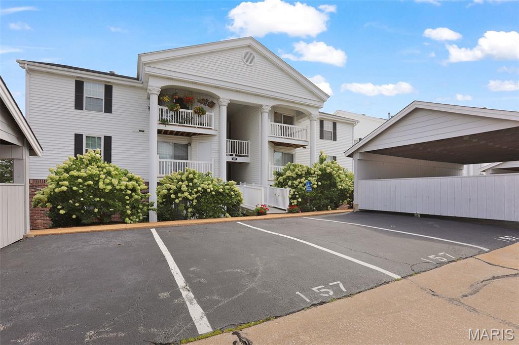 Welcome to this beautifully maintained 2-bedroom, 2-bathroom top-floor condo, ideally located near shopping, schools, parks, and major highways. The open layout features vaulted ceilings, brand new LVP flooring, and a well-appointed kitchen with stainless steel appliances. Both spacious bedrooms offer vaulted ceilings, walk-in closets, and charming plant shelves. Enjoy the convenience of in-unit laundry with washer and dryer included, plus a covered deck, private storage closet, 1-car carport, and 2 additional guest parking spaces. Just minutes from Wildwood Town Center, Rockwoods Reservation, and Wildwood Community Park! The monthly HOA fee includes water, sewer, trash, and exterior maintenance. Residents of Victoria Crossing also enjoy access to two community pools and tennis courts. Easy, low-maintenance living in a fantastic location!